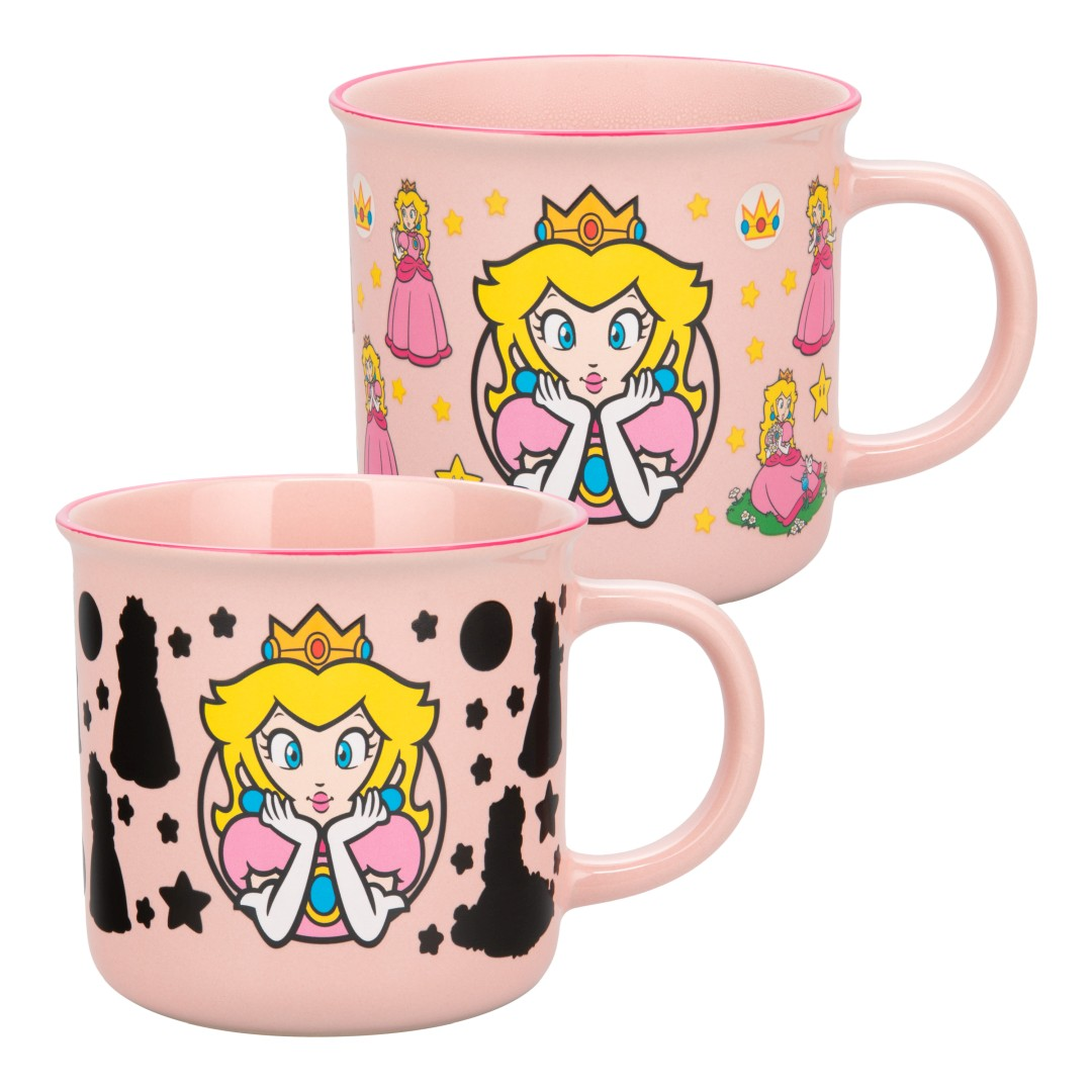 Dwa różowe kubki z Księżniczką Peach. Jeden kubek pokazuje figury szachowe, drugi gwiazdy i korony.