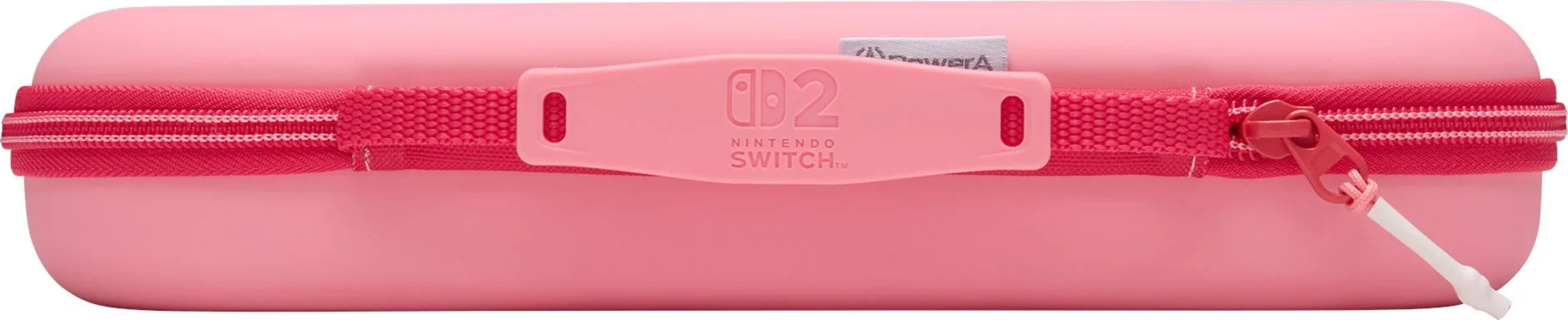 Różowe etui na Nintendo Switch z czerwonym zamkiem i uchwytem.