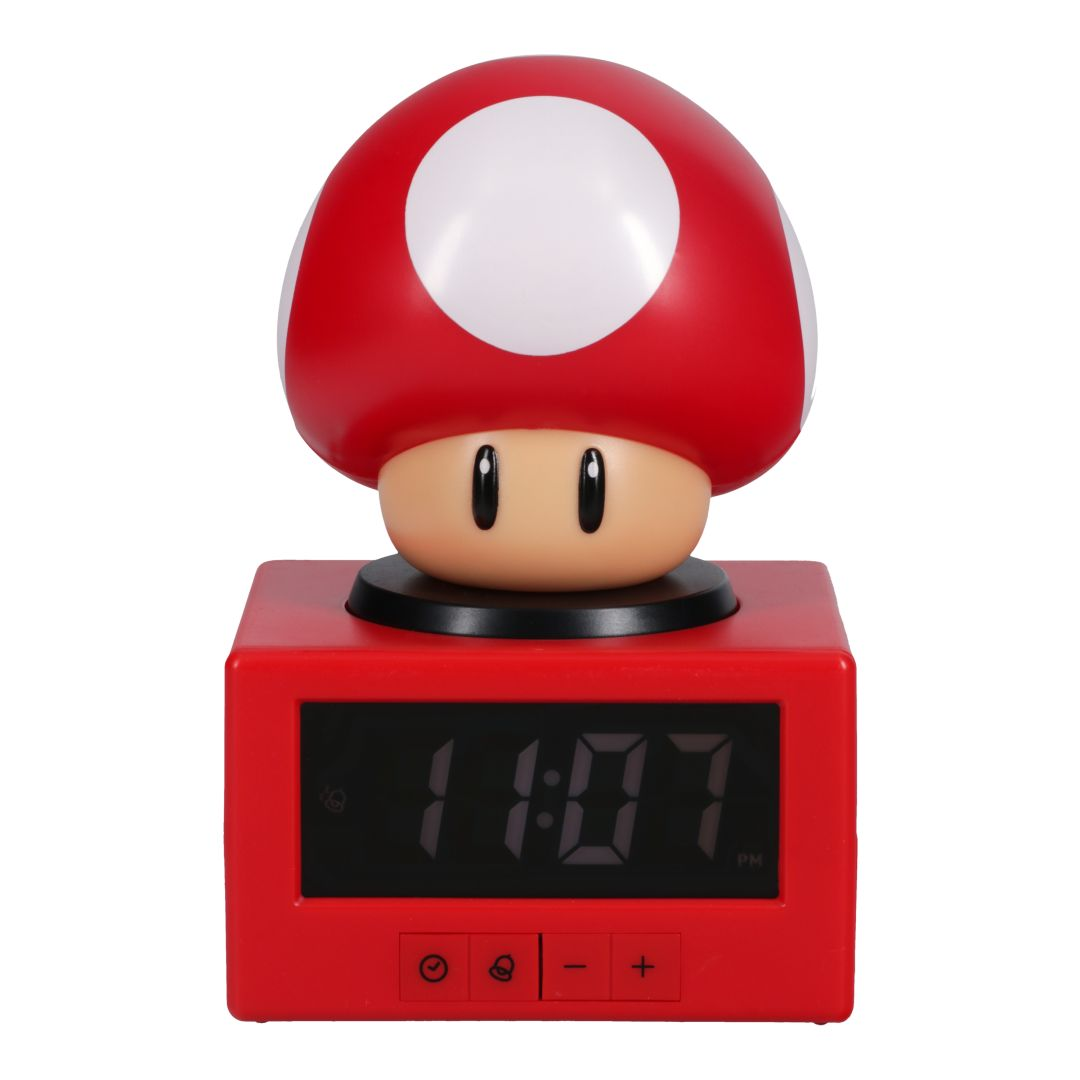 Czerwony budzik w kształcie grzyba Mario pokazuje 11:07. Grzyb ma białe kropki i twarz.