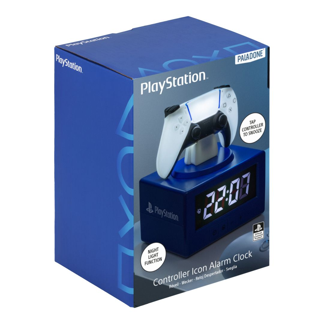 Niebieskie pudełko budzika z kontrolerem PlayStation i białym kontrolerem na górze.