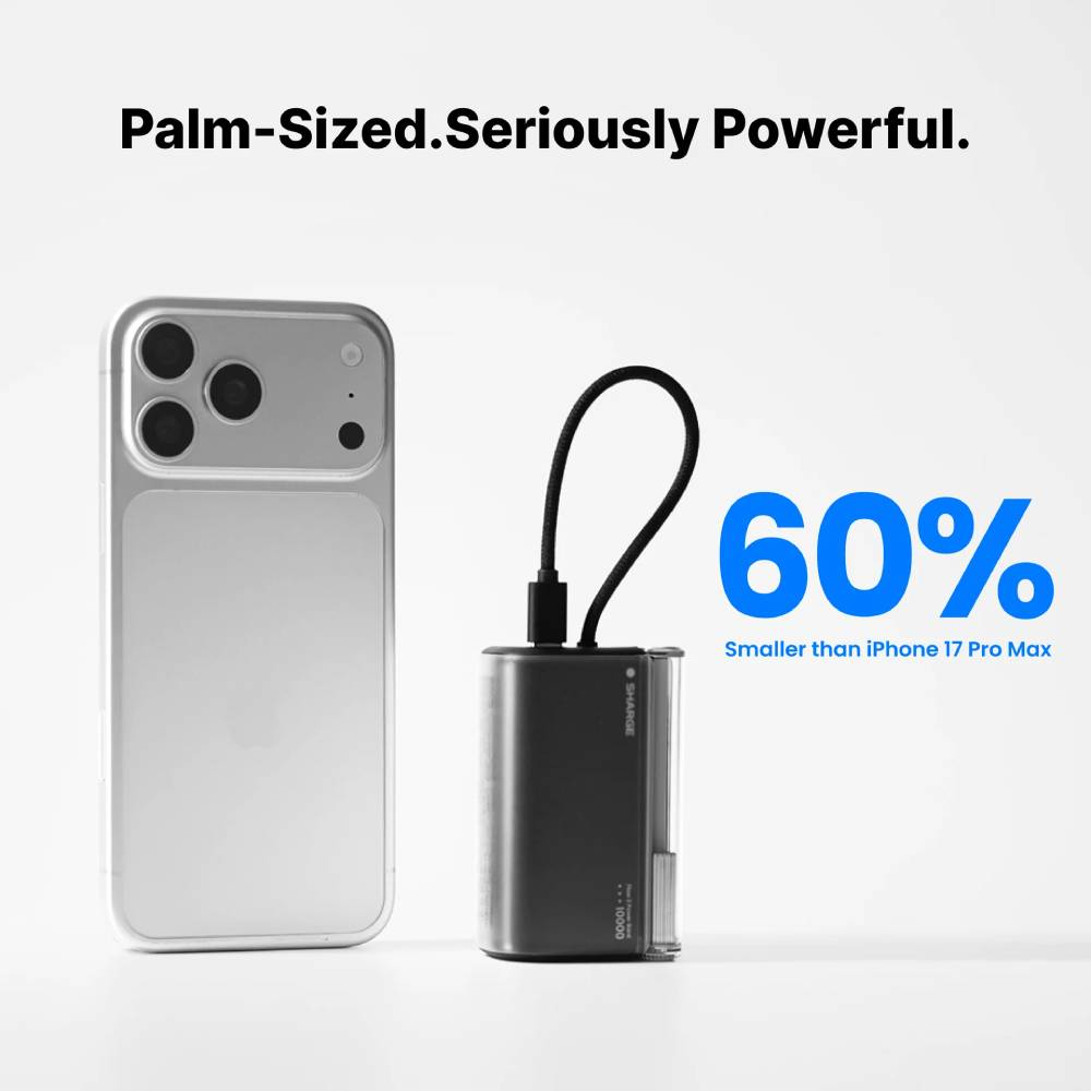 Un iPhone argenté à côté d'une batterie externe noire affichant 60%.