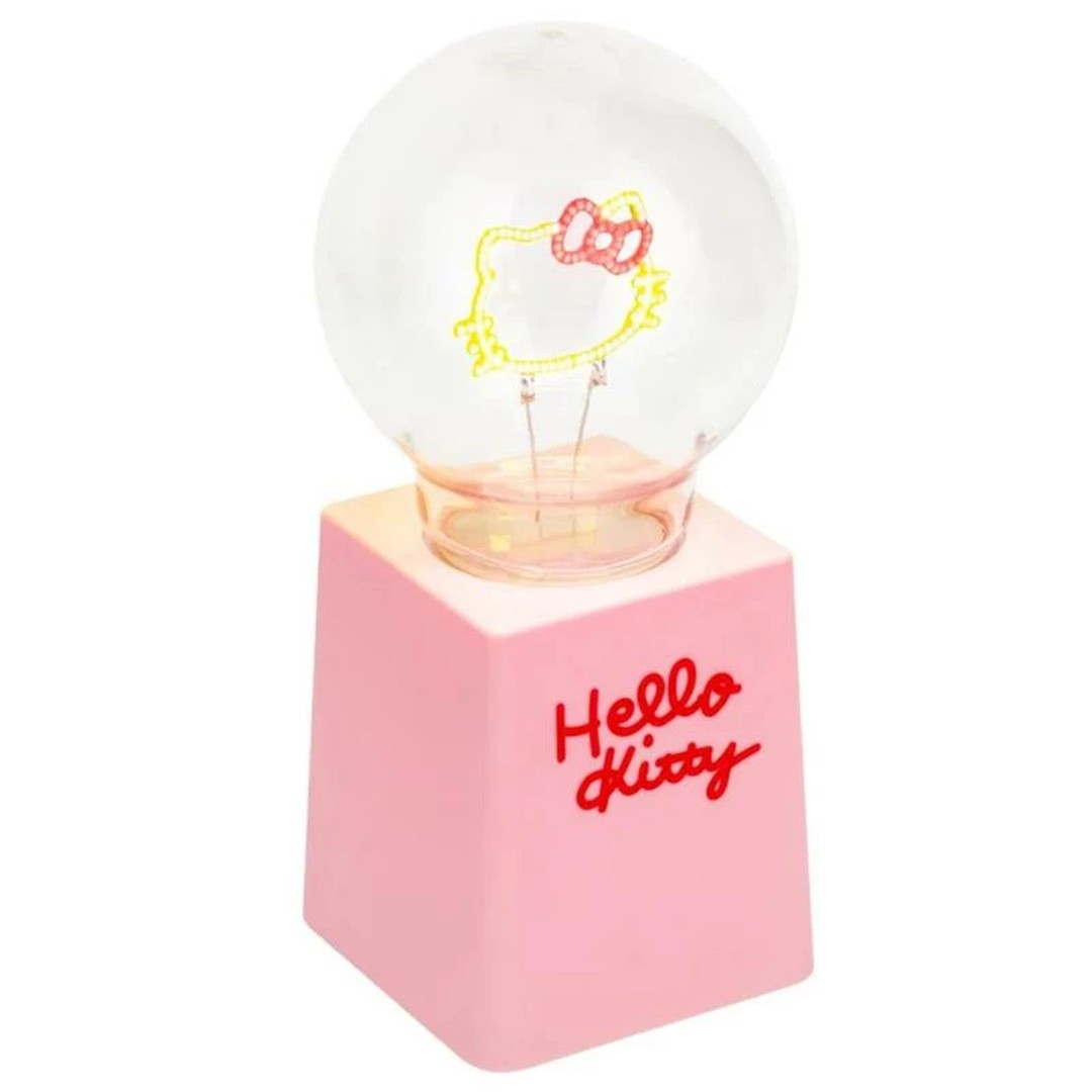 Różowa lampa z motywem Hello Kitty i żarówką.