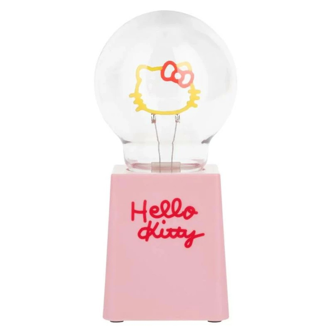 Żarówka z Hello Kitty w środku, na różowej podstawie z napisem.