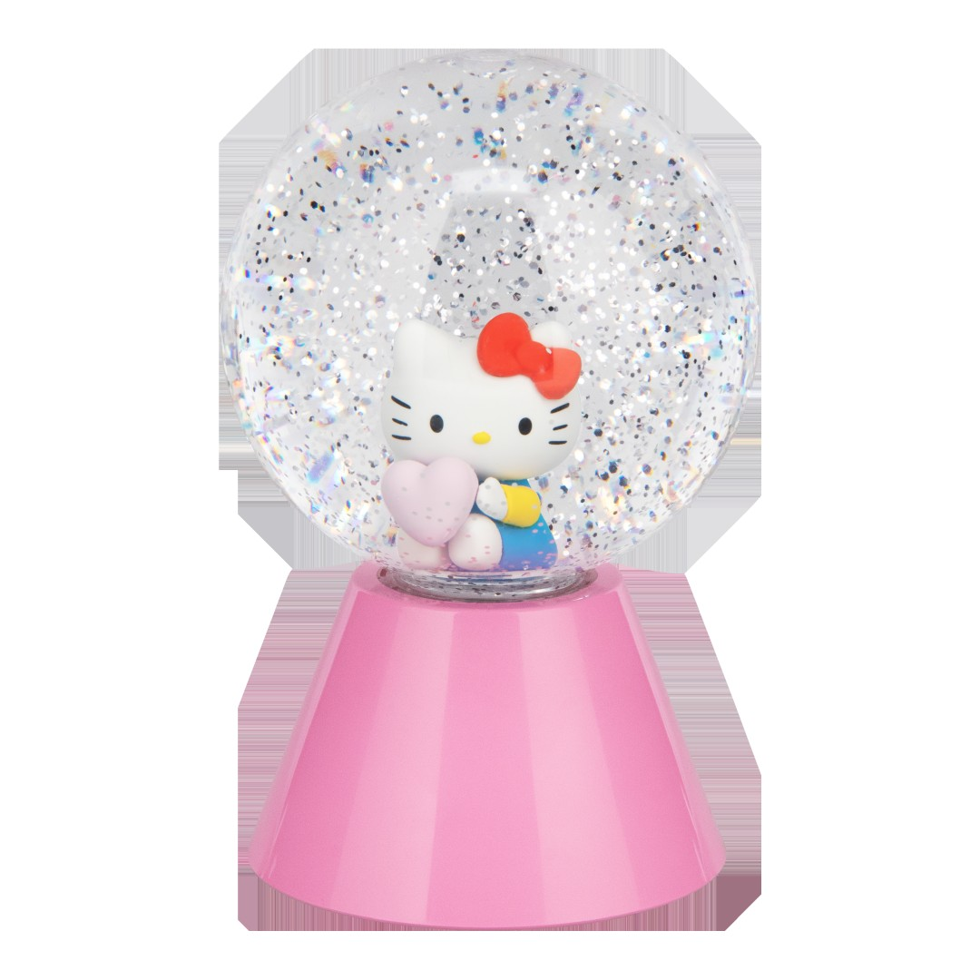 Hello Kitty w kuli śnieżnej trzymająca serce na różowej podstawie.