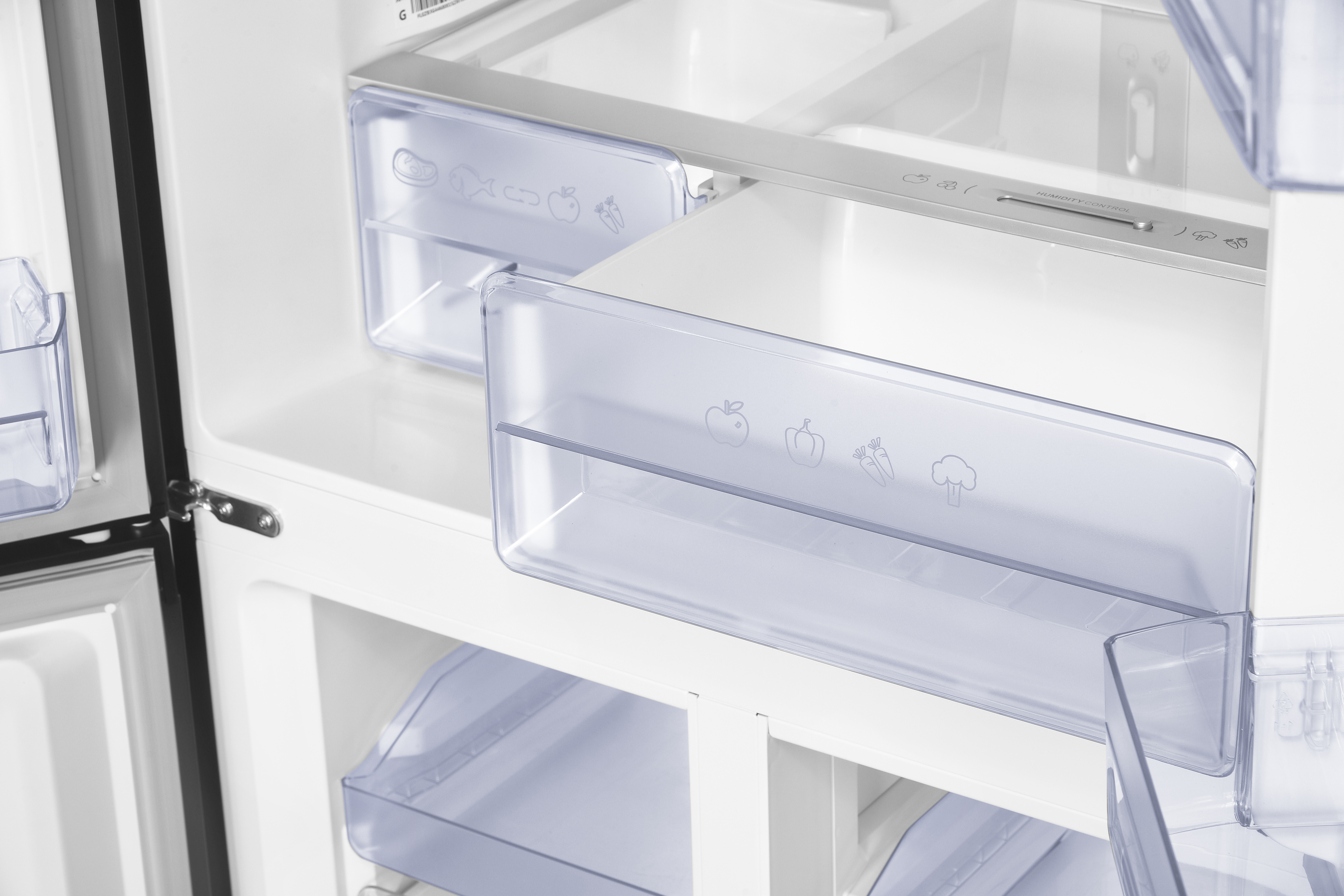 An open refrigerator with clear drawers and food icons.