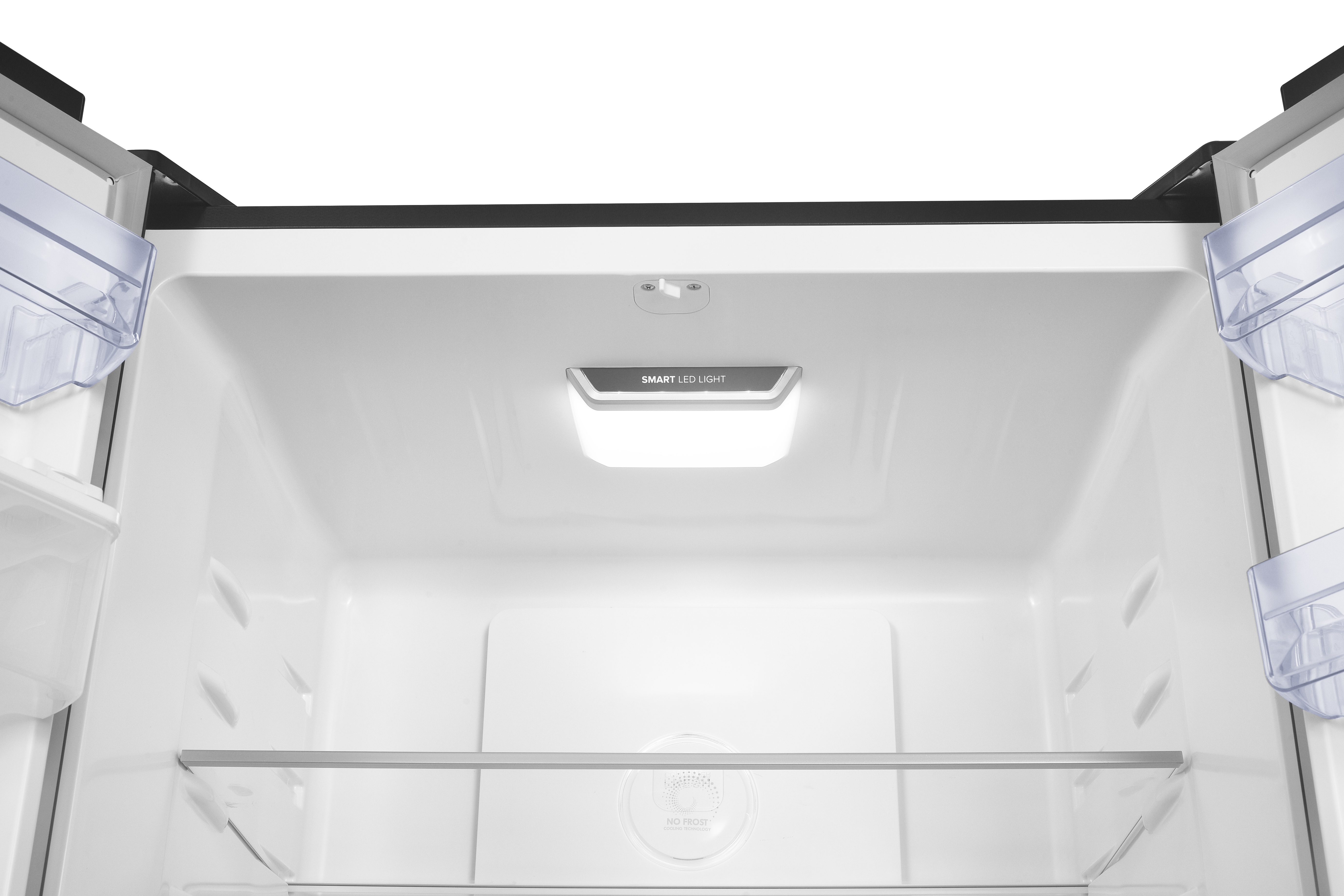 Inside of a refrigerator with a glass shelf and illuminated LED panel.