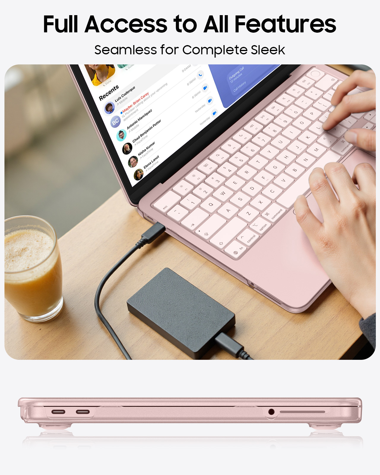 Ein rosafarbenes MacBook mit einem Glas Saft und einer externen Festplatte.