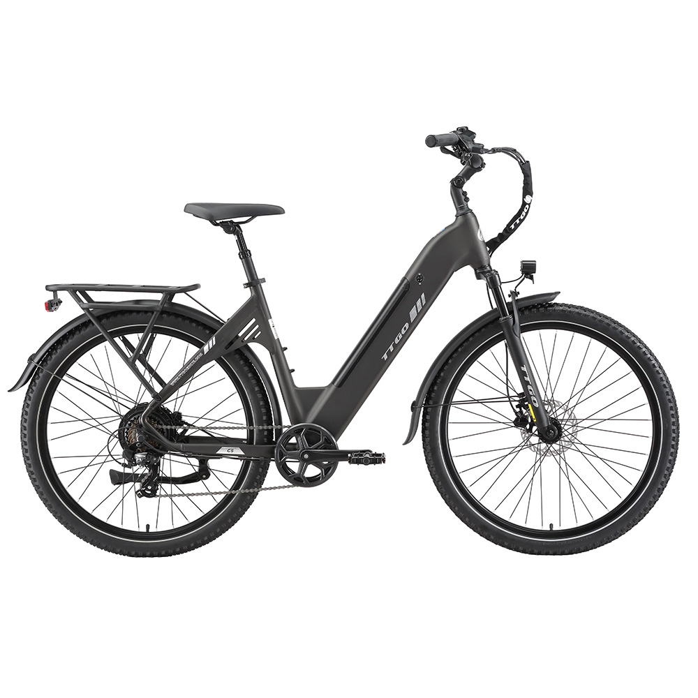 Una bicicletta elettrica nera con portapacchi posteriore e forcella ammortizzata.