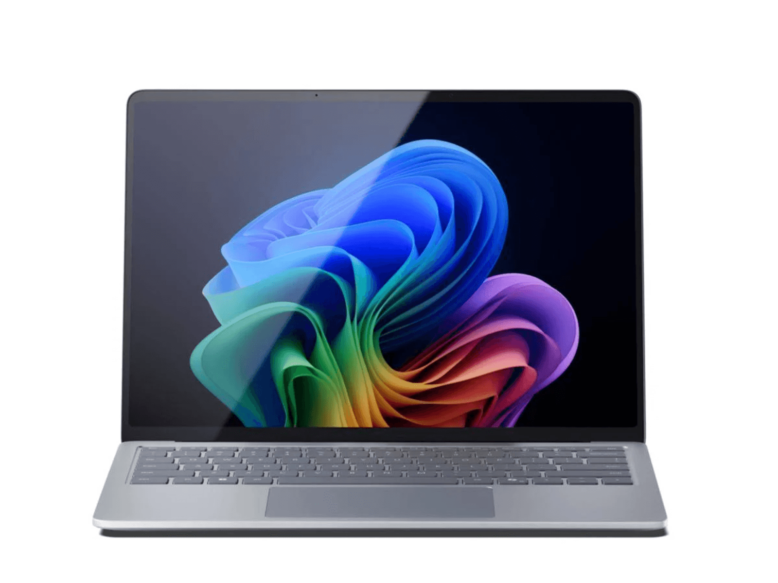 Srebrny laptop z kolorowym, abstrakcyjnym tłem na ekranie.