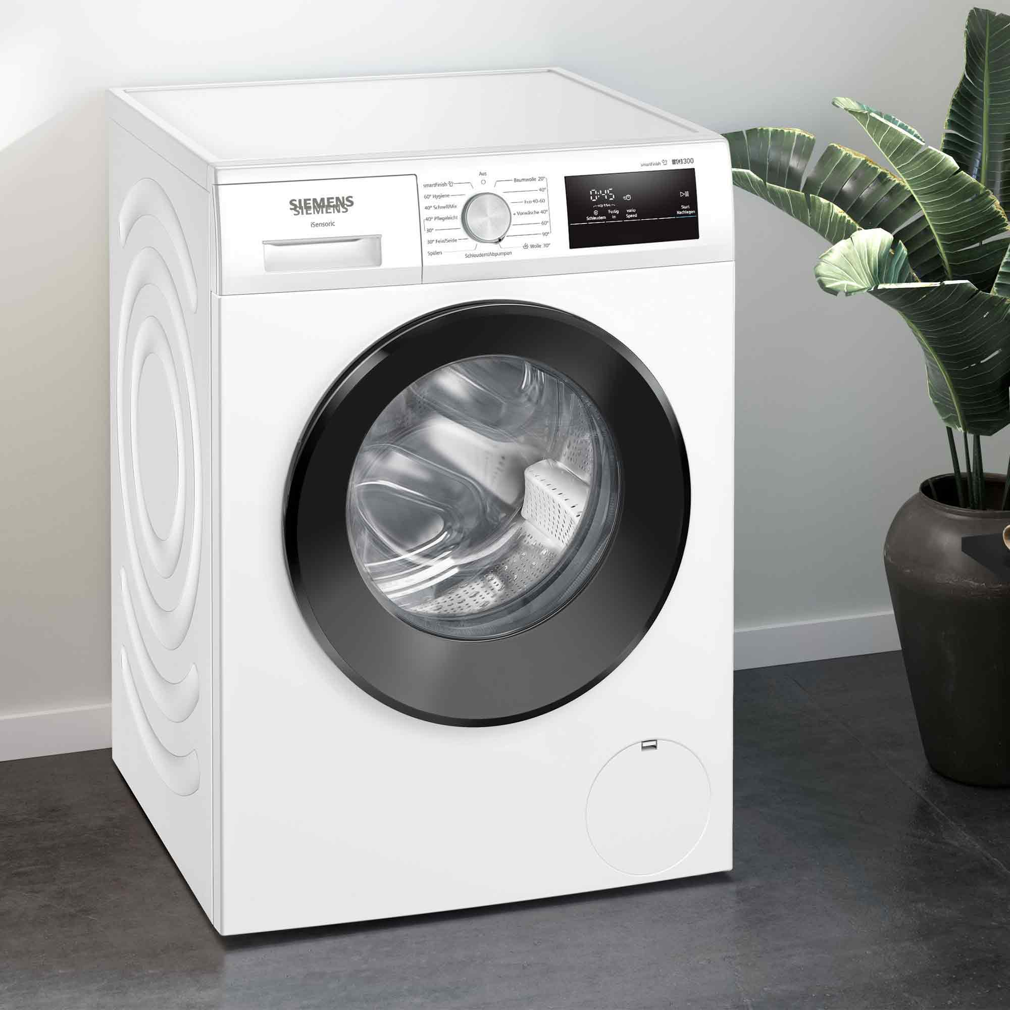 Eine weiße Siemens-Waschmaschine mit schwarzer Tür und Bedienfeld.