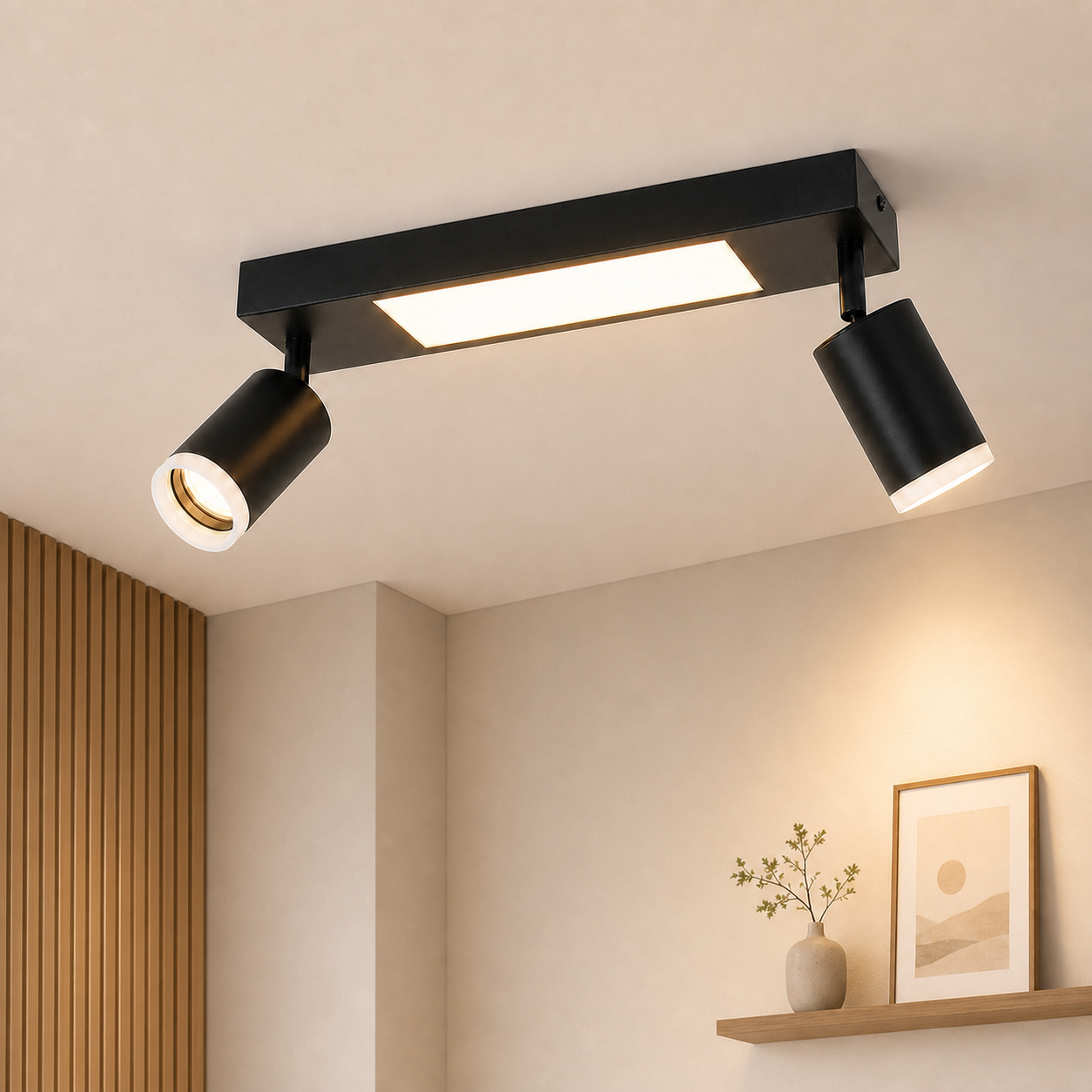 Faretti da soffitto neri con due spot regolabili e una barra luminosa integrata.