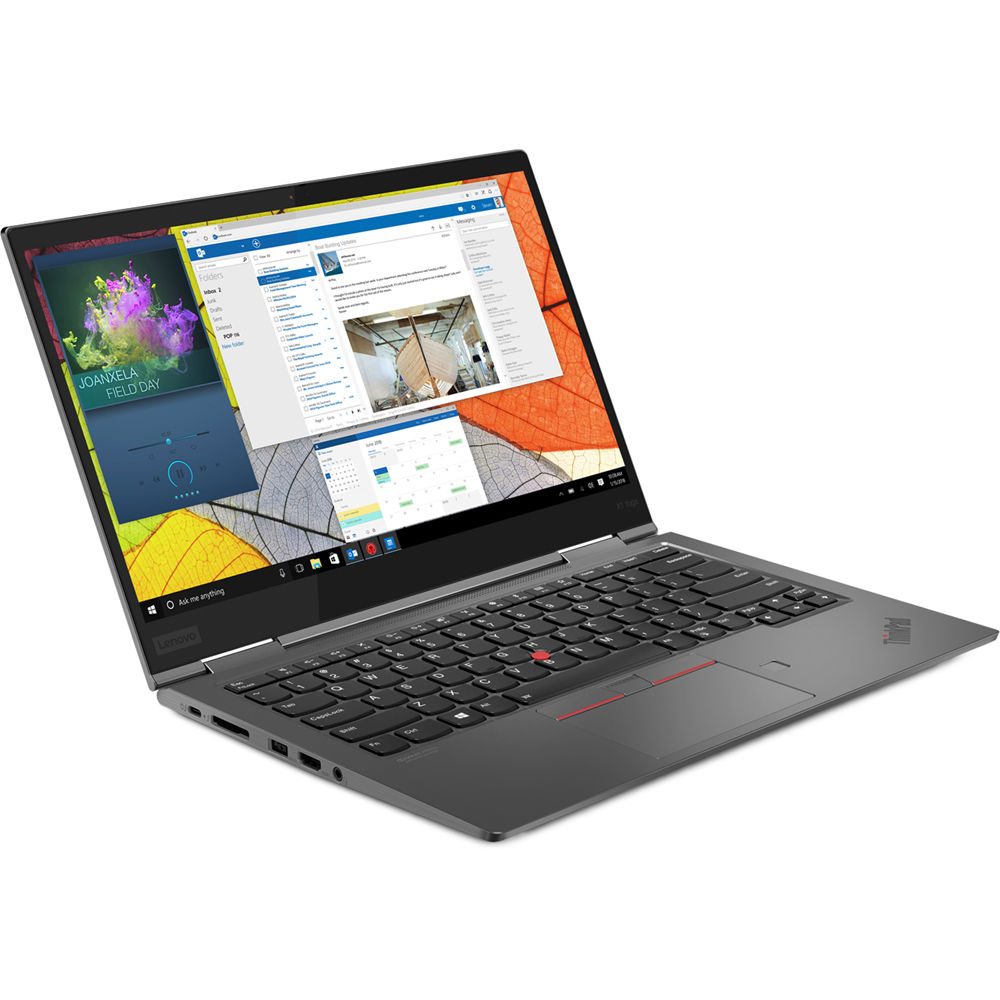 Ciemnoszary laptop Lenovo jest otwarty, wyświetla różne okna na ekranie.