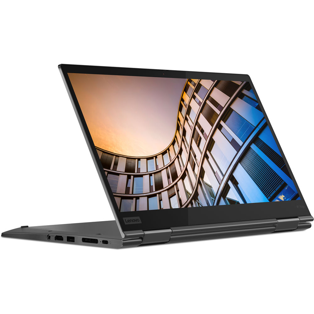 Otwarty laptop Lenovo z zakrzywionym budynkiem na ekranie.