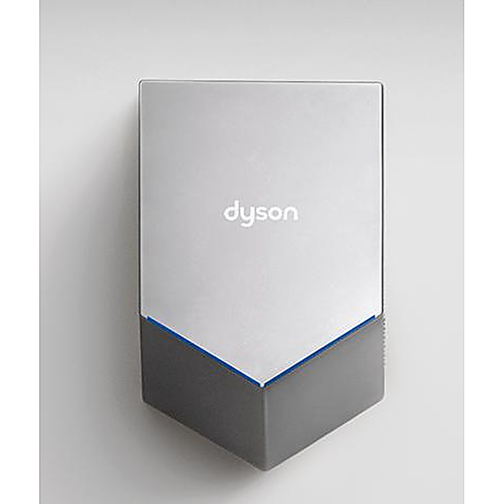 Un asciugamani Dyson argentato con base grigio scuro è montato su una parete bianca.
