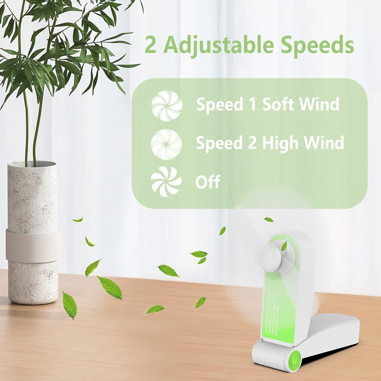 Ein kleiner weißer Ventilator mit grünen Akzenten, der Blätter simuliert.