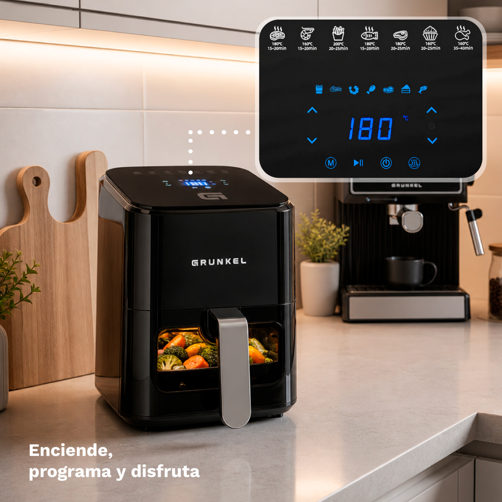 Freidora de aire negra con verduras y panel de control. Ajustada a 180°C.