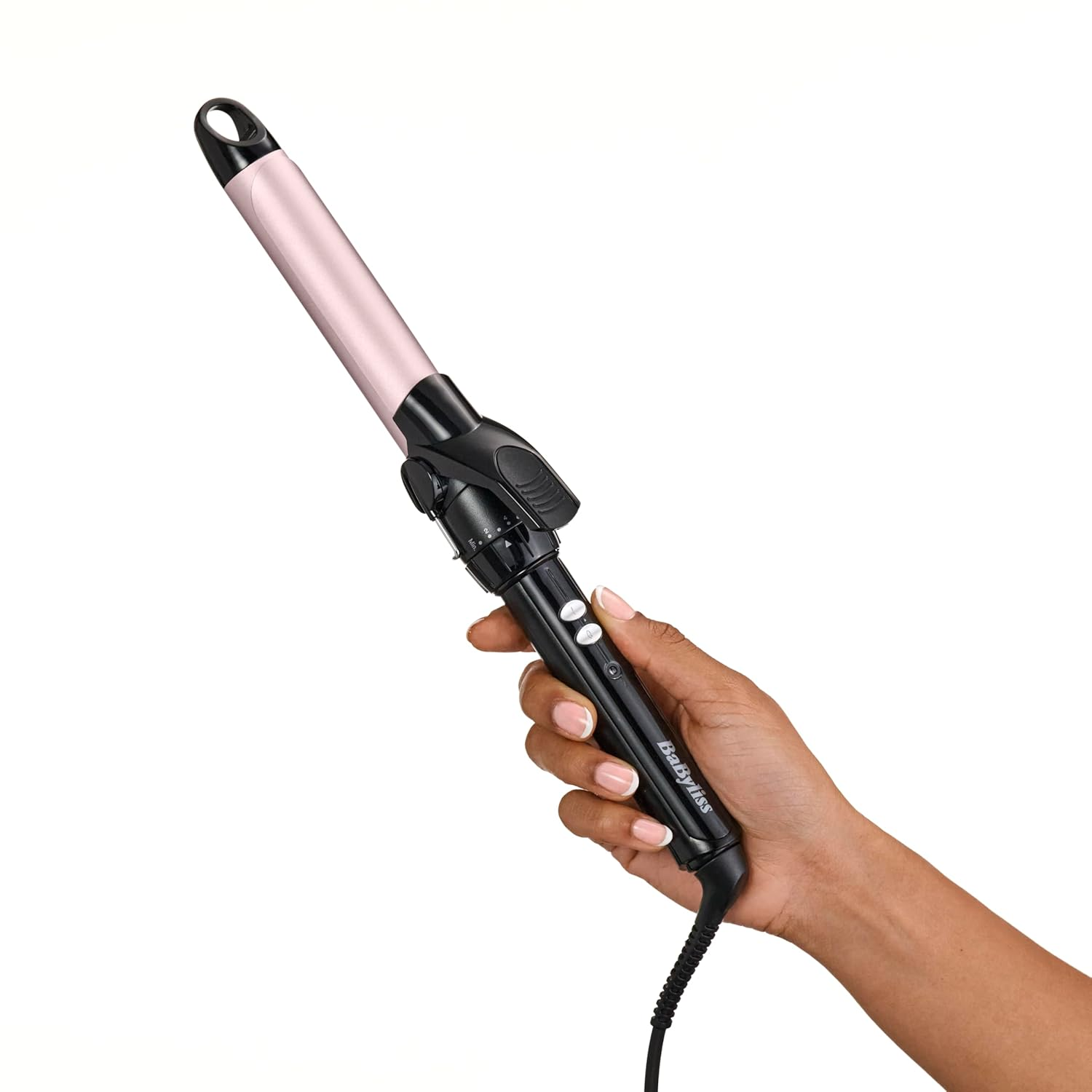 A hand holds a pink curling iron with a black handle against a white background.