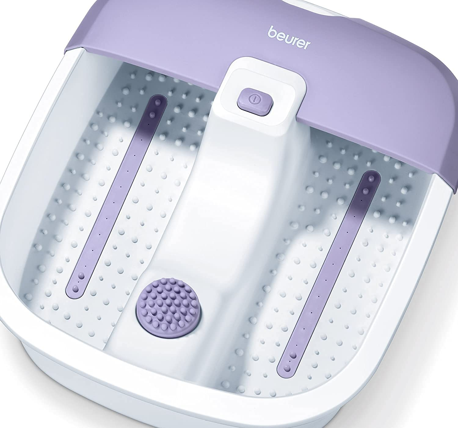A purple and white foot bath massager with 'beurer' branding.