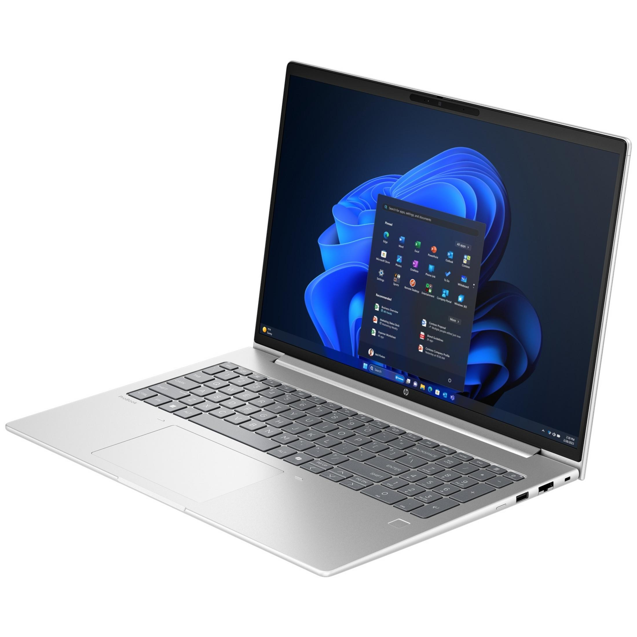 A silver laptop displaying Windows 11 with its Start menu open, showing apps.