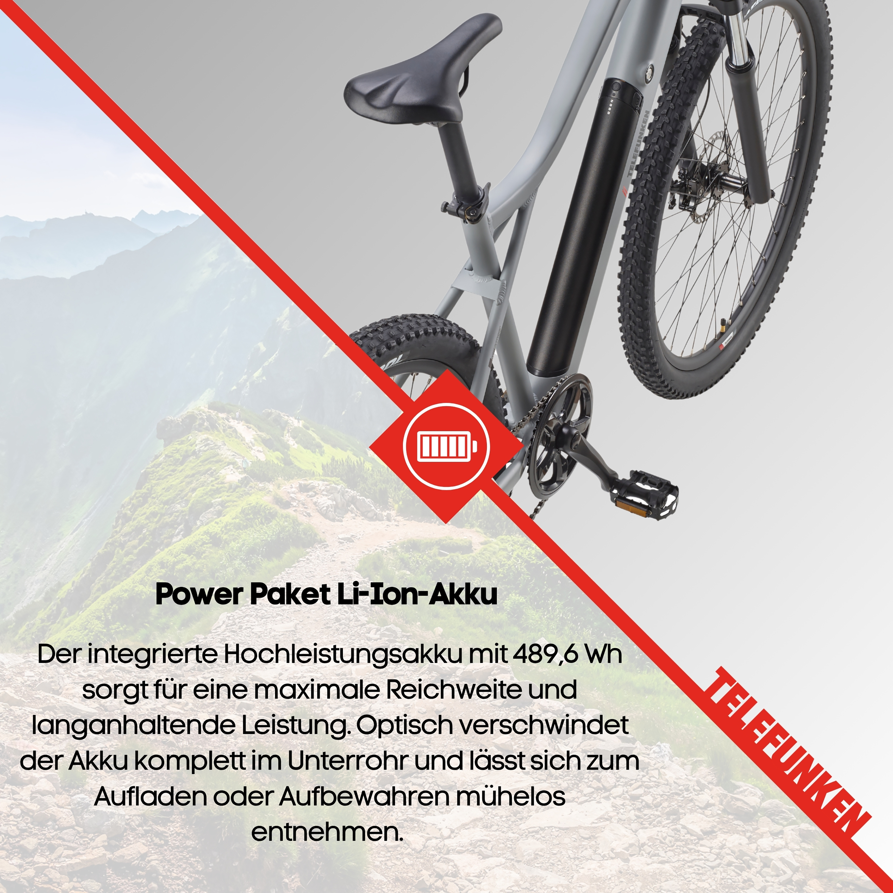 Ein graues E-Bike mit einem integrierten Akku und Berglandschaft im Hintergrund.