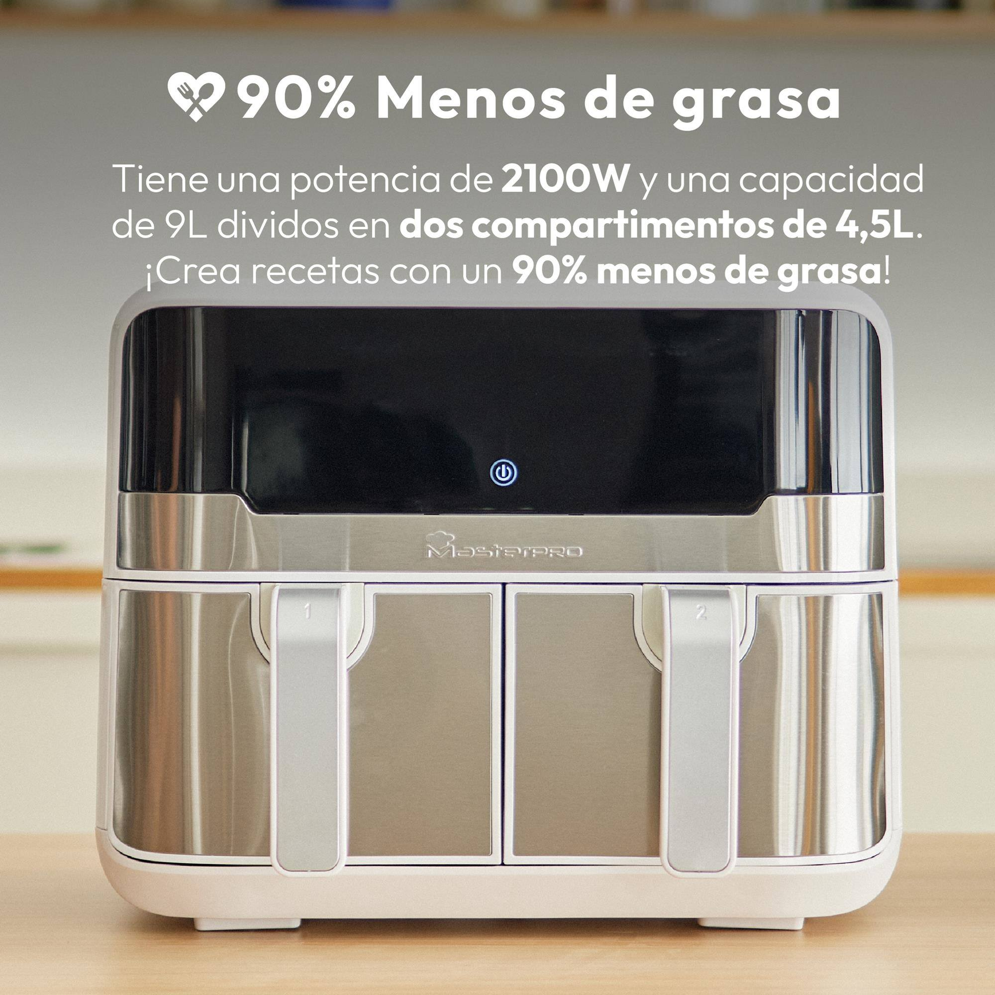 Una freidora de aire plateada y blanca con dos cajones está sobre una mesa de madera.