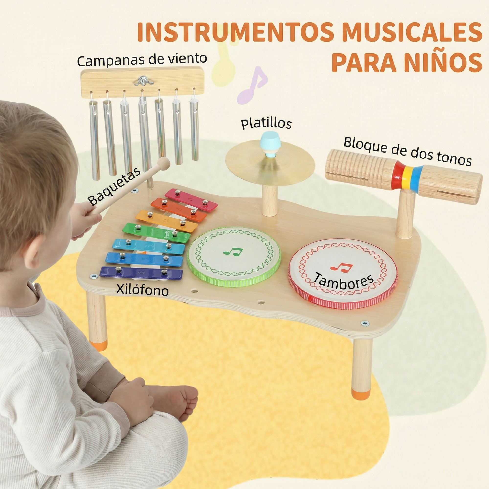 Un niño toca un set de instrumentos musicales de madera con xilófono, tambores, campanas.