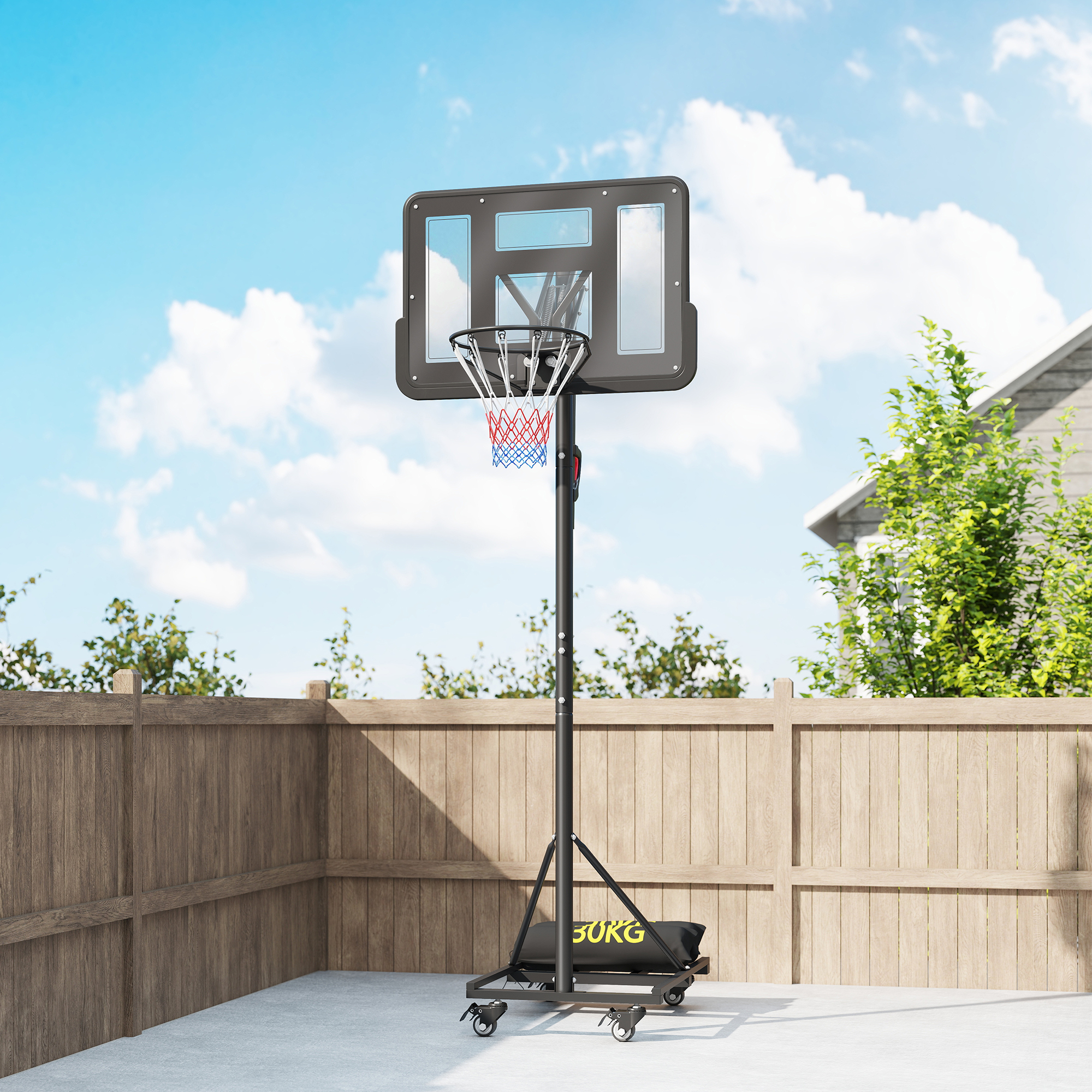 Una canasta de baloncesto está en un patio bajo un cielo azul con nubes.
