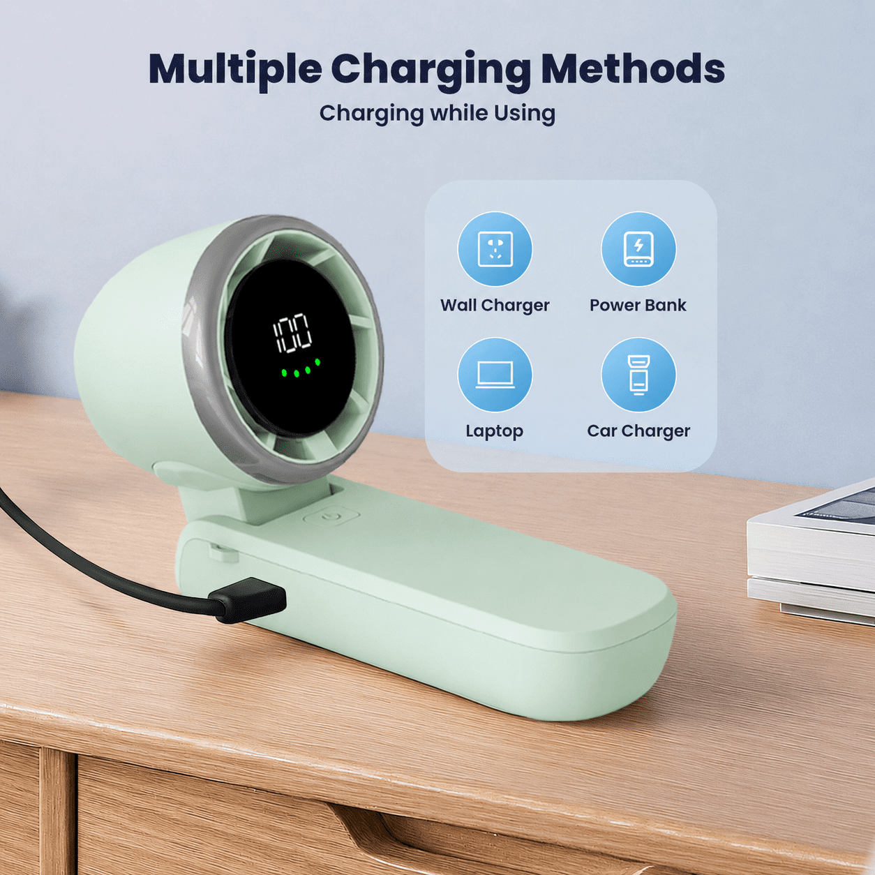 Ein grüner Ventilator mit eingestecktem USB-Kabel, der 100 % Ladung anzeigt.