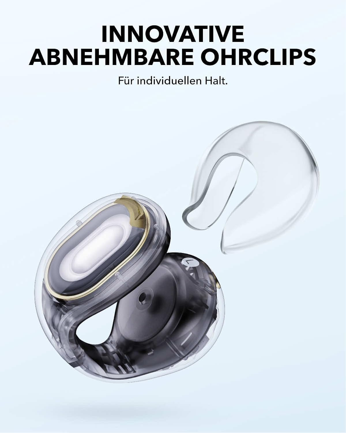 Transparente Ohrclips und ein Teil eines Kopfhörers mit schwarzen und goldenen Akzenten.