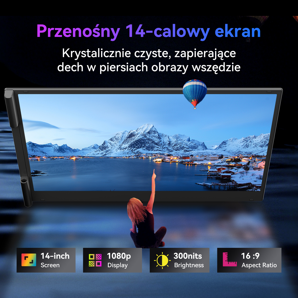 Ekran 14 cali wyświetla ośnieżone miasteczko nad morzem z balonem.