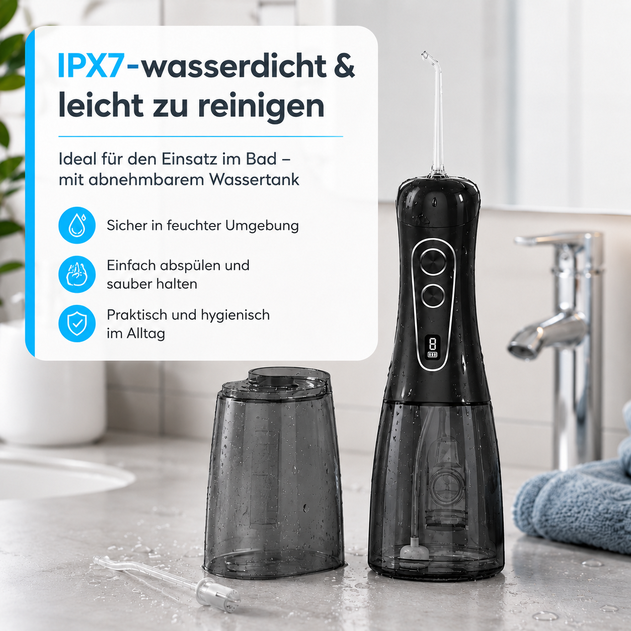 Schwarzer, wasserdichter IPX7 Mundduschen-Set mit abnehmbarem Tank, auf einem Badezimmerwaschtisch.