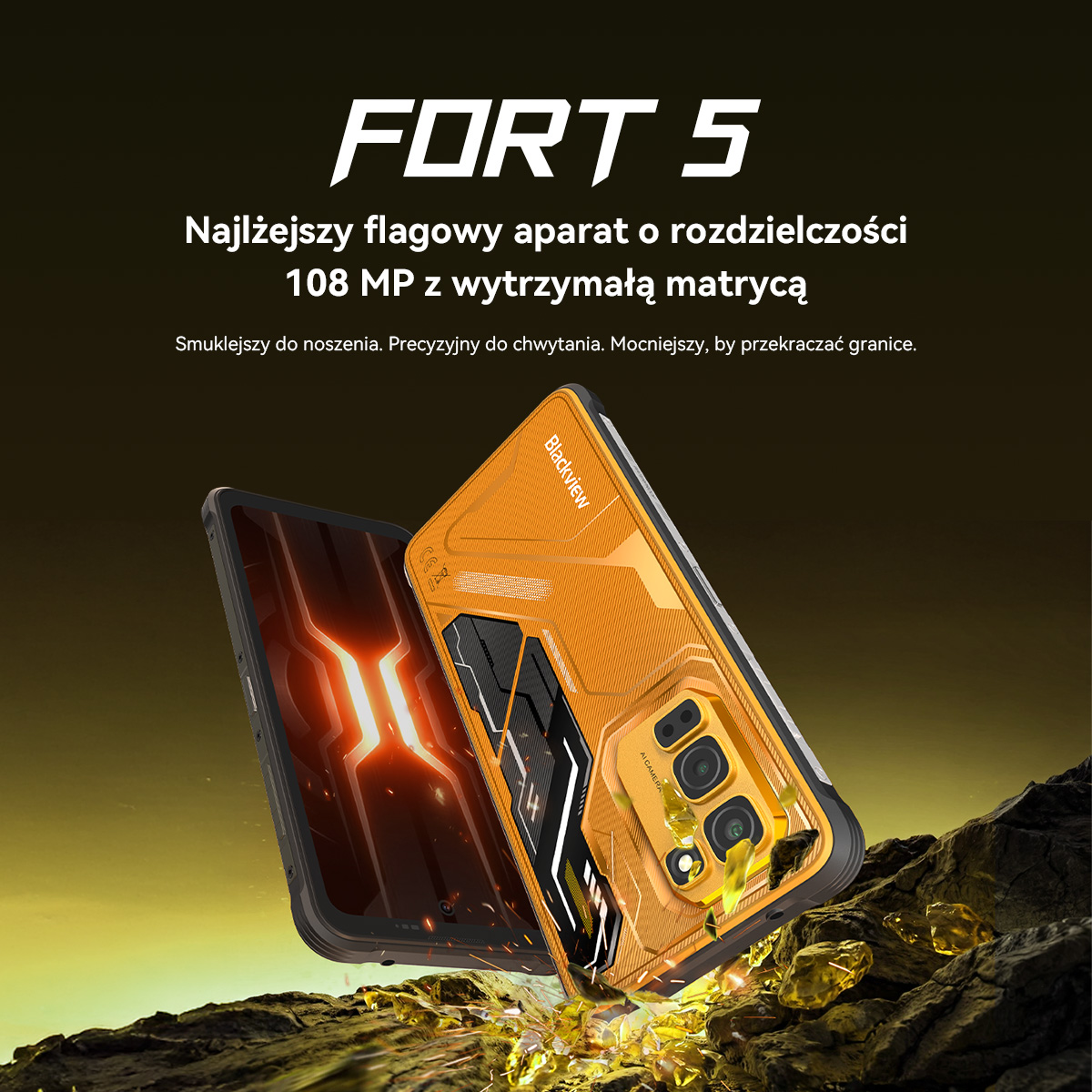 Pomarańczowy i czarny smartfon z tylnymi aparatami, leżący na skałach.