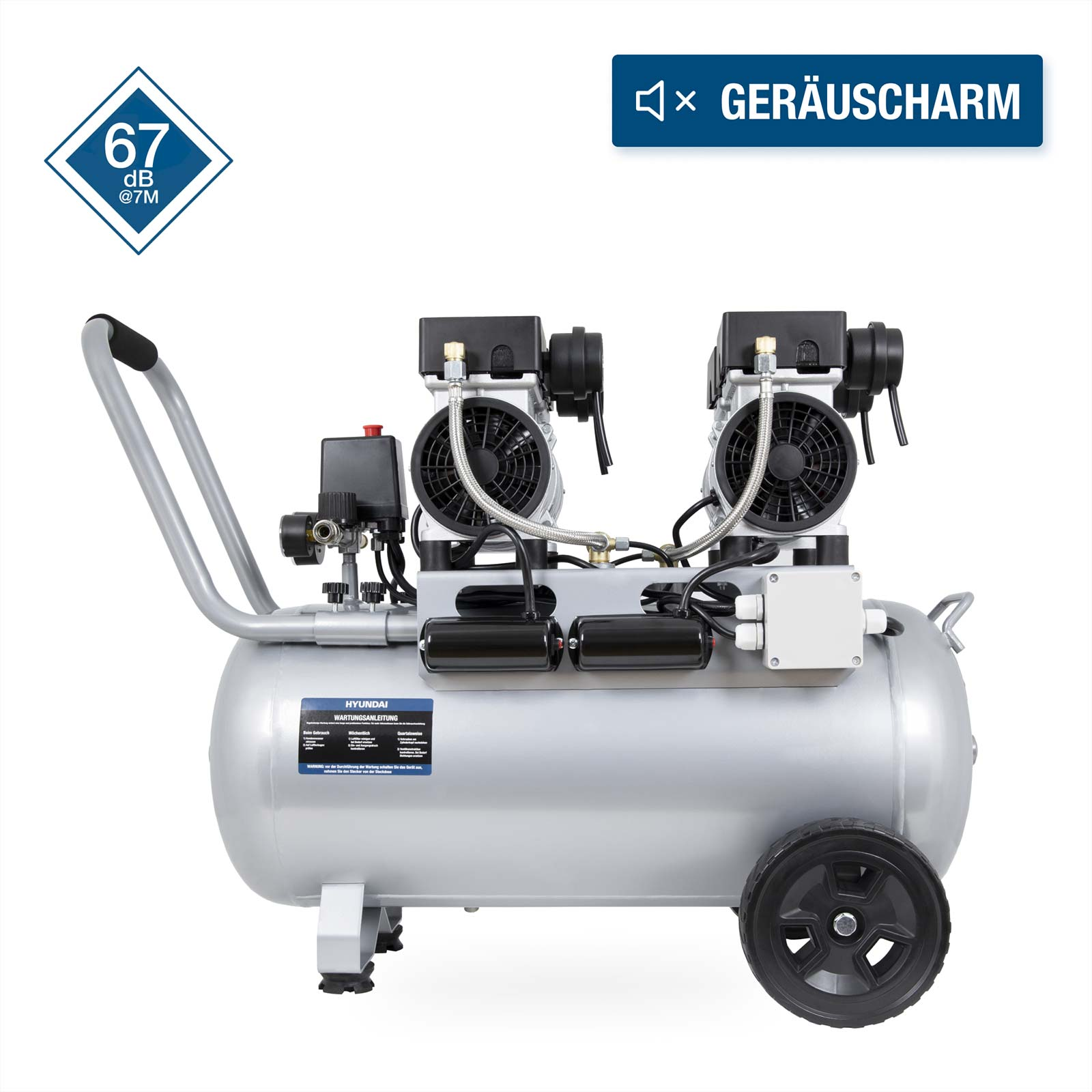 Ein silberner Kompressor mit zwei Motoren, Rädern und einem Griff.