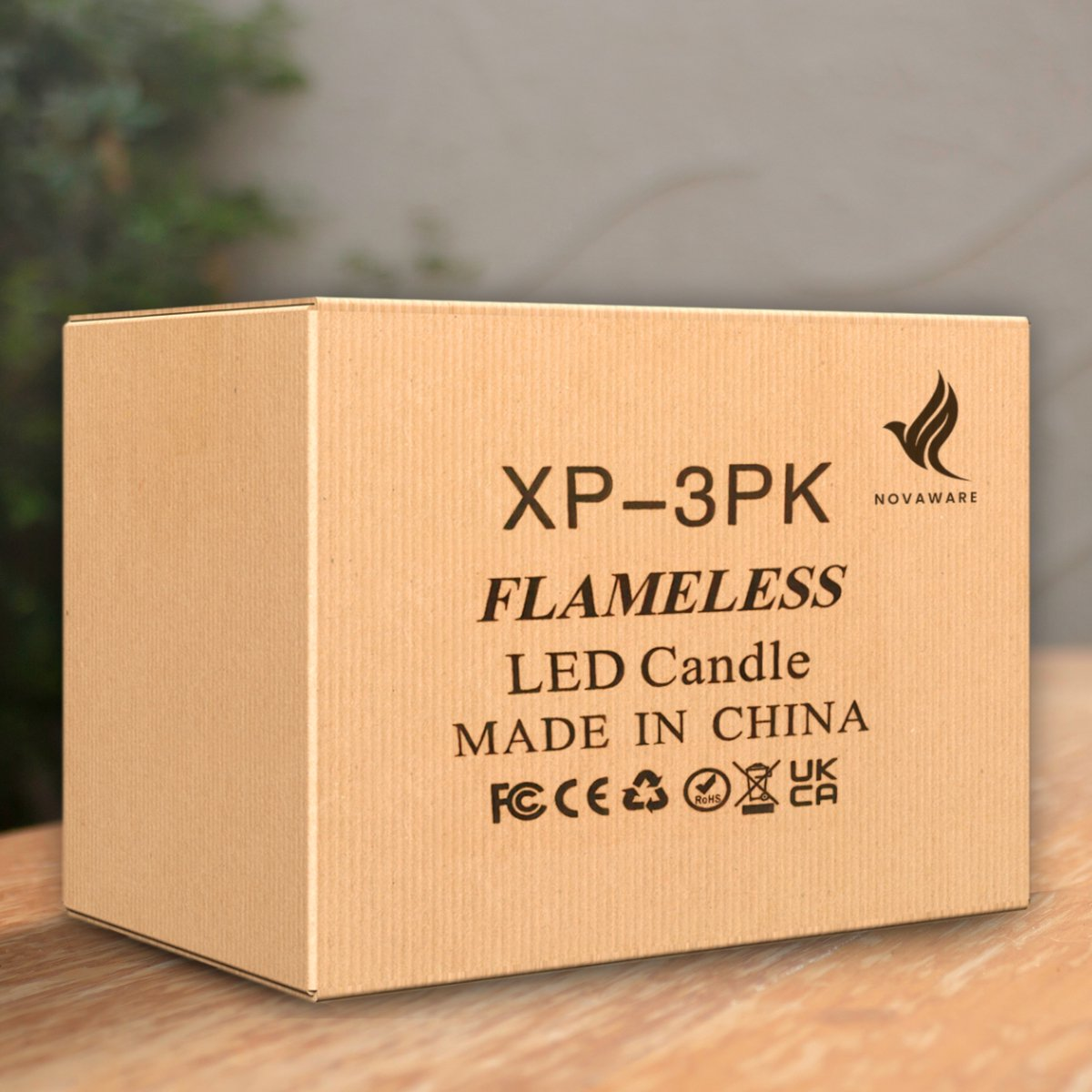 Brown cardboard box with "FLAMELESS LED Candle" text and logos.
