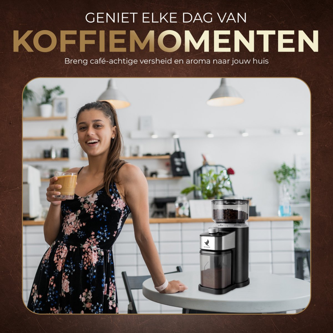 A young woman holds a drink in a coffee shop next to a coffee grinder.