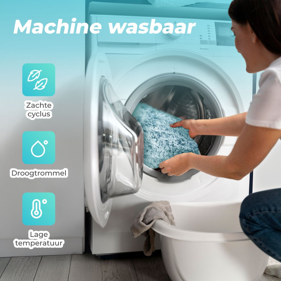 Woman loads blue fluffy rug into washing machine. Icons show gentle cycle, tumble dry.