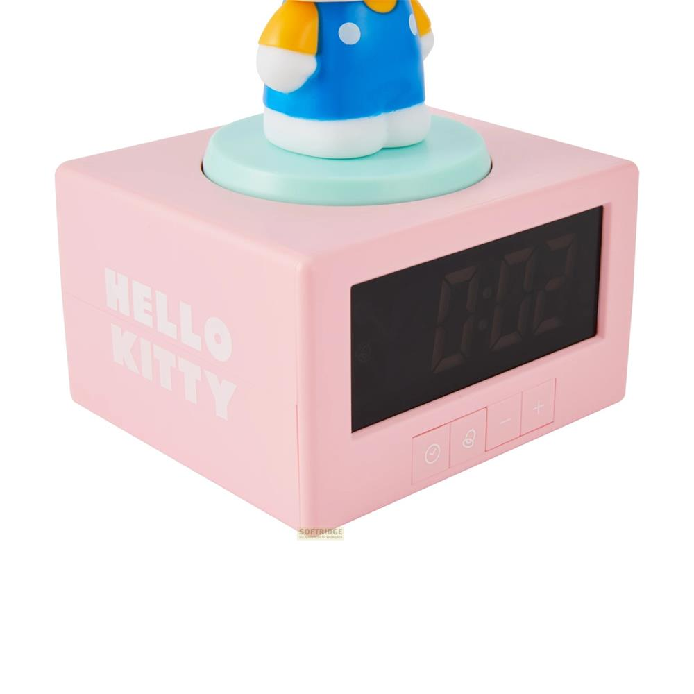 Różowy budzik Hello Kitty z cyfrowym wyświetlaczem pokazującym 0:02.