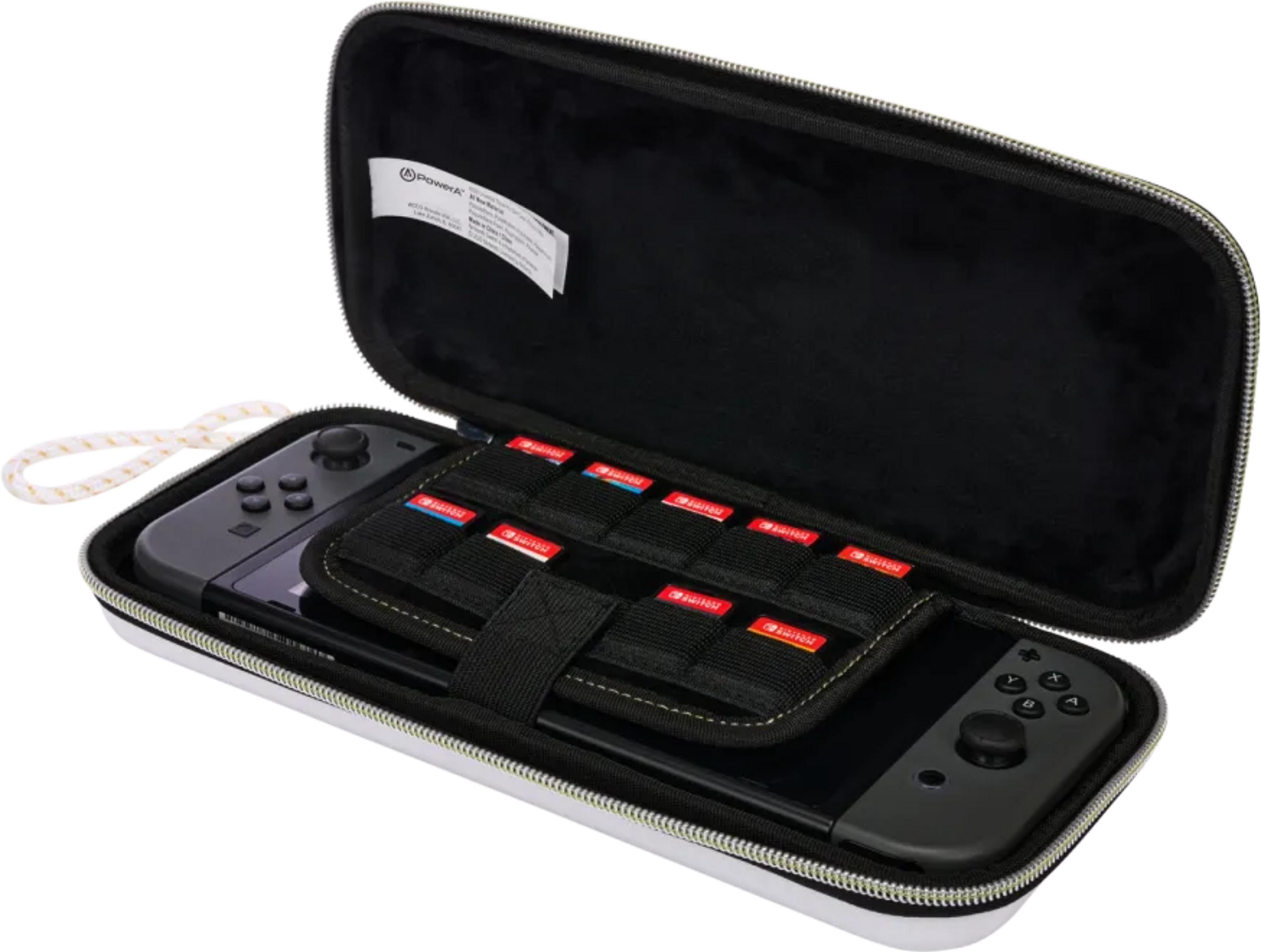 Otwarta biała torba na Nintendo Switch z czarną wyściółką. Kontroler po lewej, konsola po prawej. Dziesięć gier w siatce.