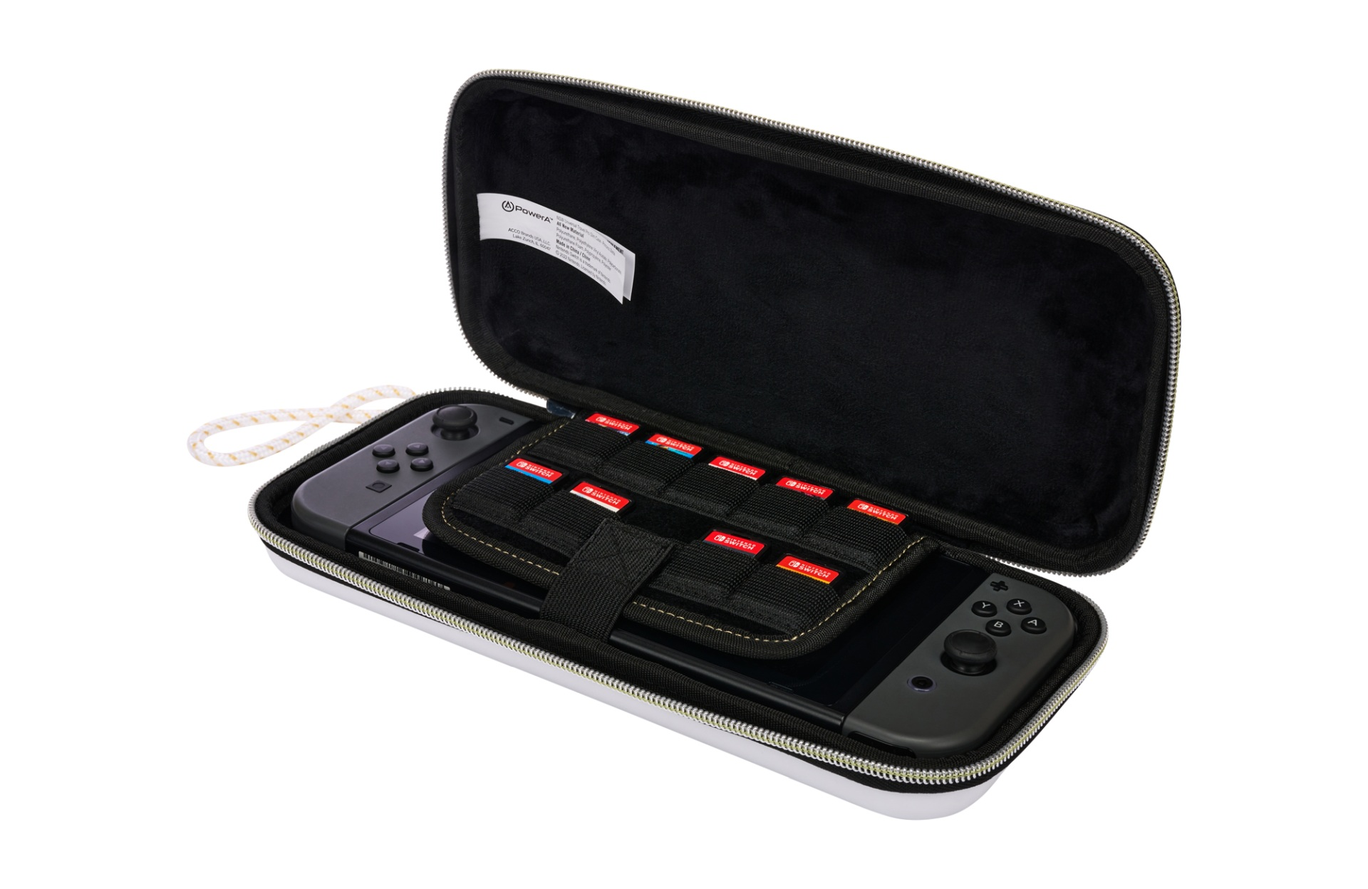 Otwarty biały futerał z konsolą Nintendo Switch, kontrolerami i kartridżami.