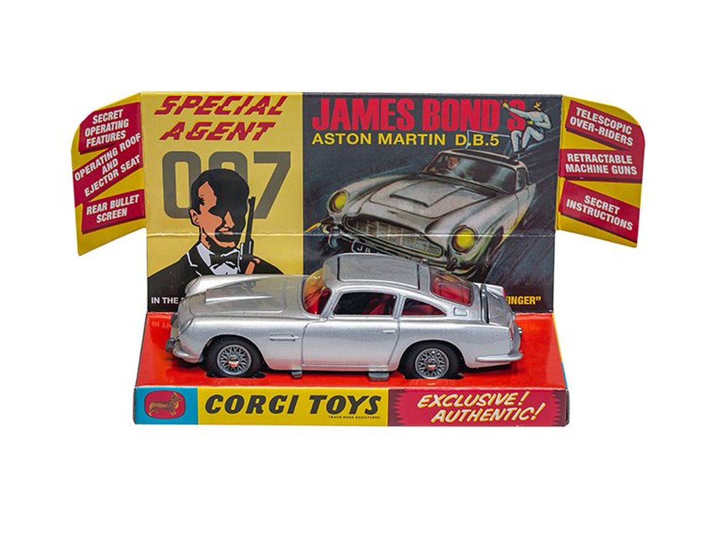 Srebrna zabawka Corgi Aston Martin DB.5 Jamesa Bonda w pudełku z grafiką.