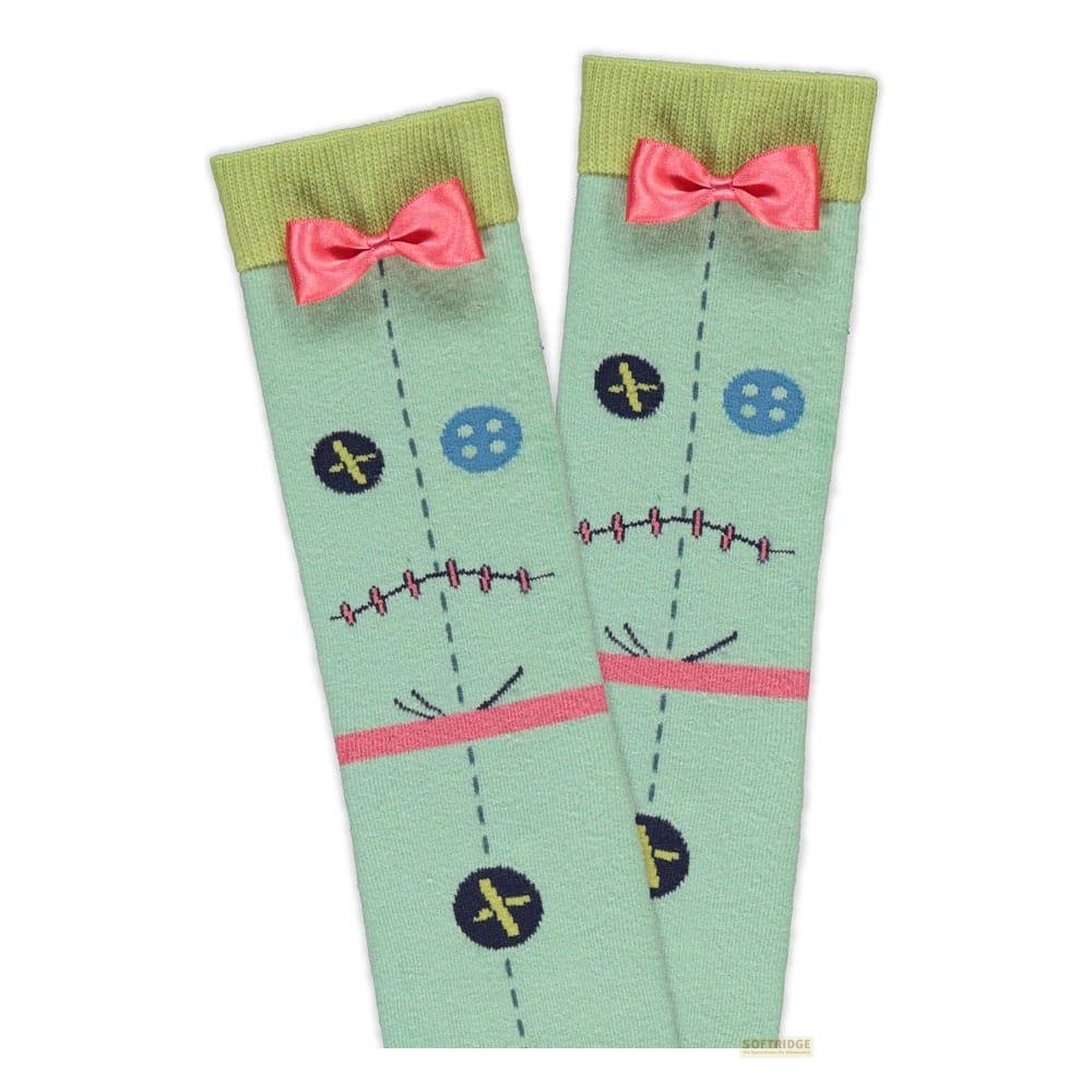 Hellgrüne Socken mit Puppengesichtsdesign und rosa Schleifen.