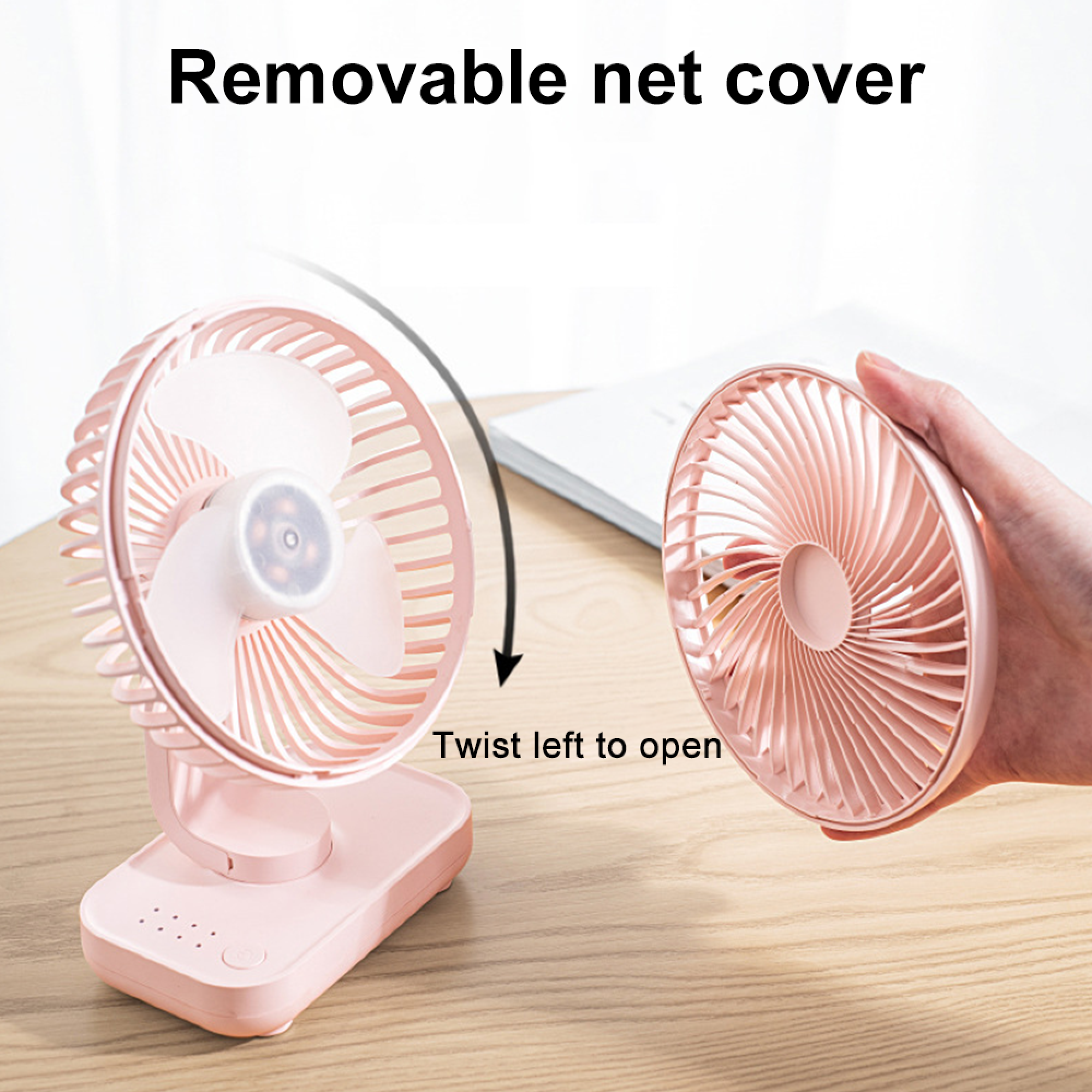 Ein rosa Ventilator mit abnehmbarer Netzabdeckung und Pfeil, der zum Öffnen nach links zeigt.