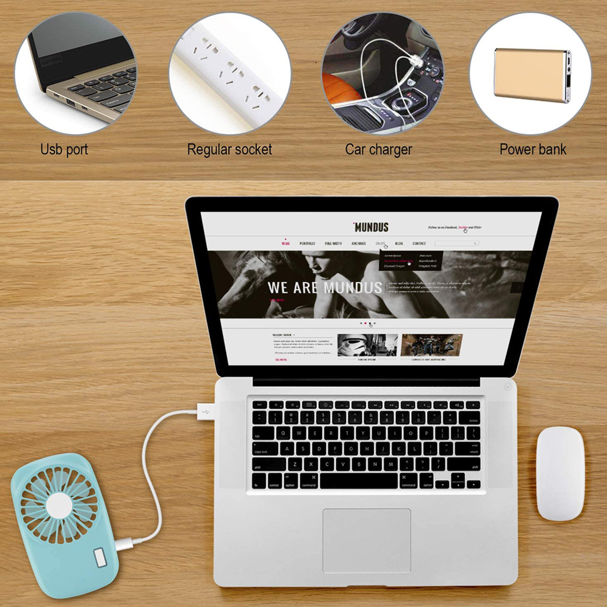 Ein Laptop, ein Ventilator und eine Maus auf einem Holztisch.