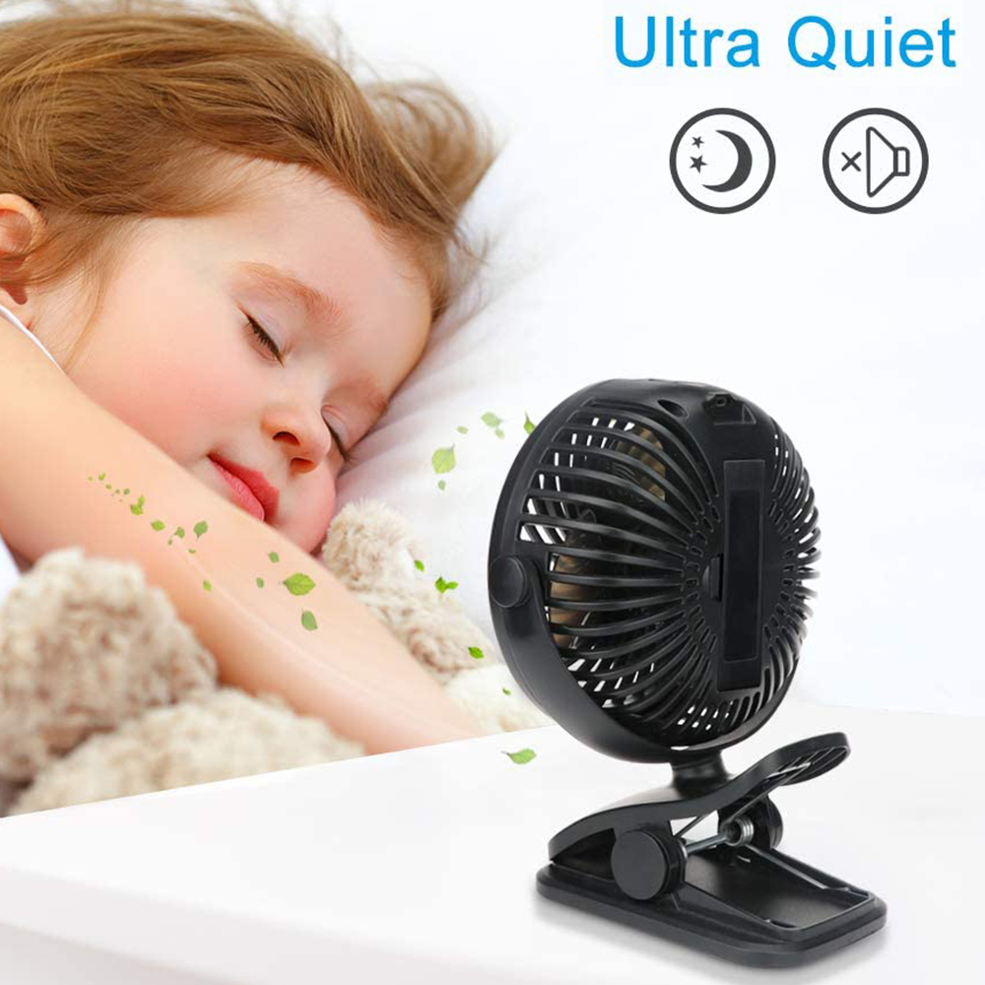 Ein kleines schwarzes Clip-on-Mini-USB-Ventilator neben einem schlafenden Baby.