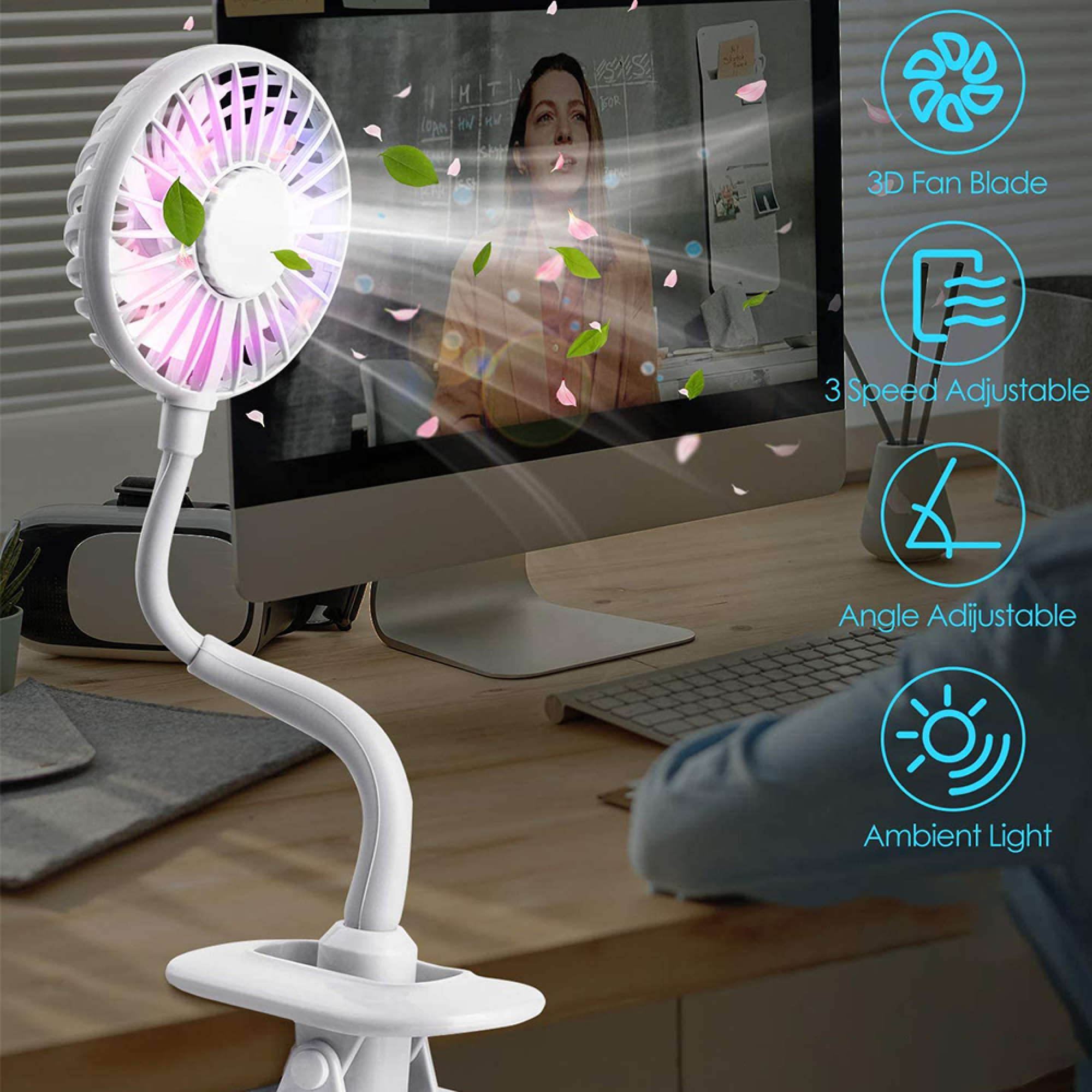 Ein weißer Schwanenhalsventilator mit rosa Licht auf einem Holzschreibtisch.