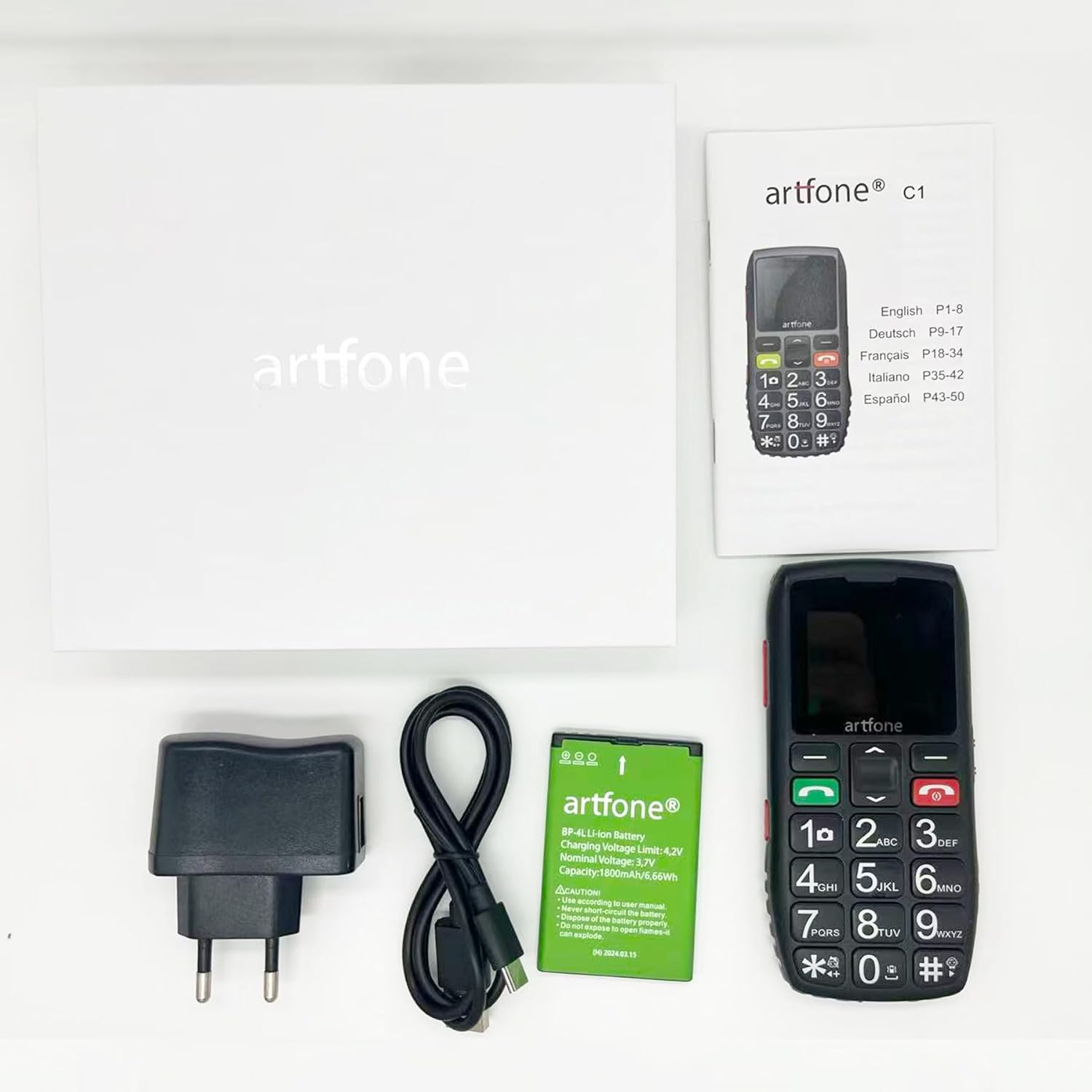 Artfone C1 Handy-Set mit Ladeadapter, Kabel, Akku und Anleitung.
