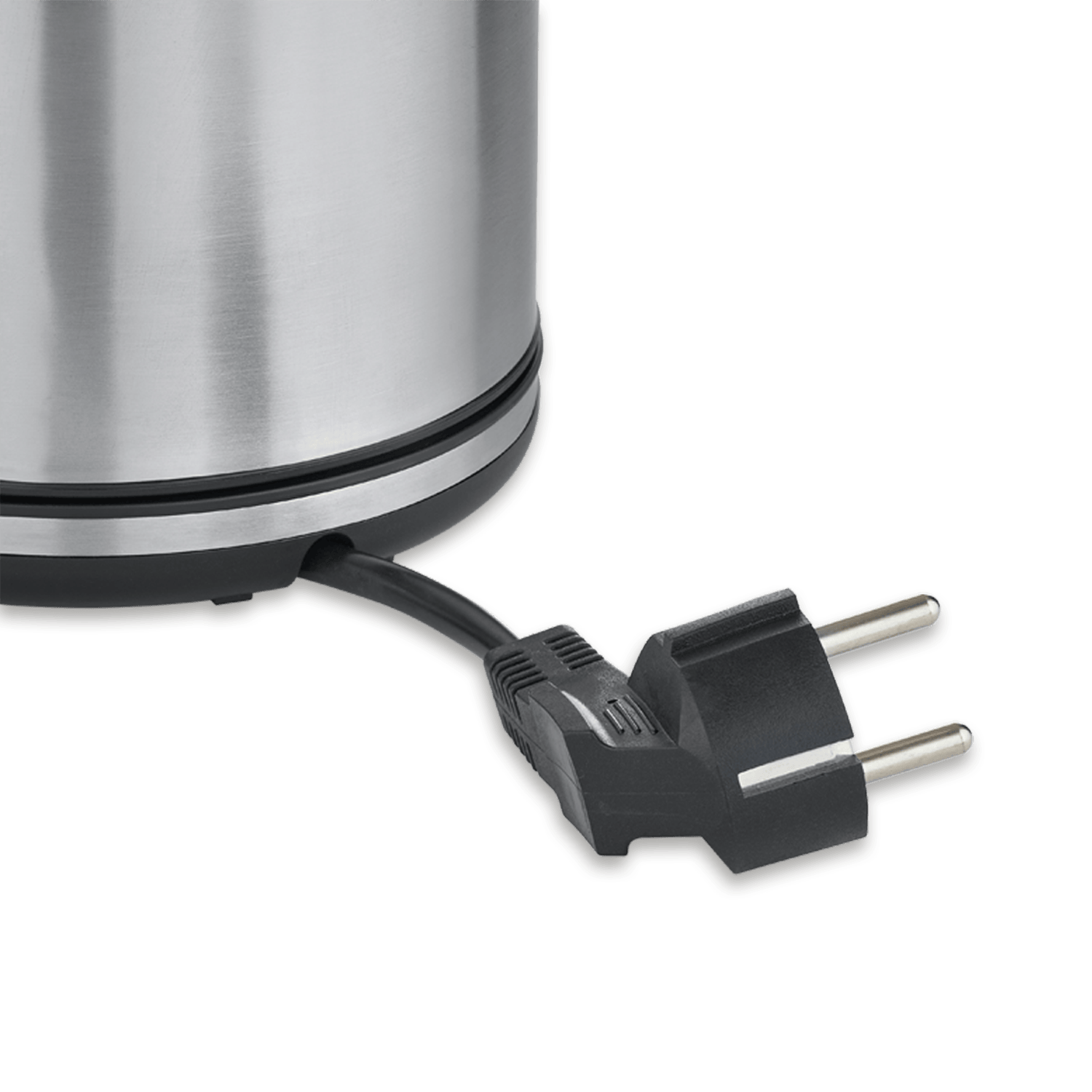 A black plug with two metal prongs on a cord extending from a silver kettle.