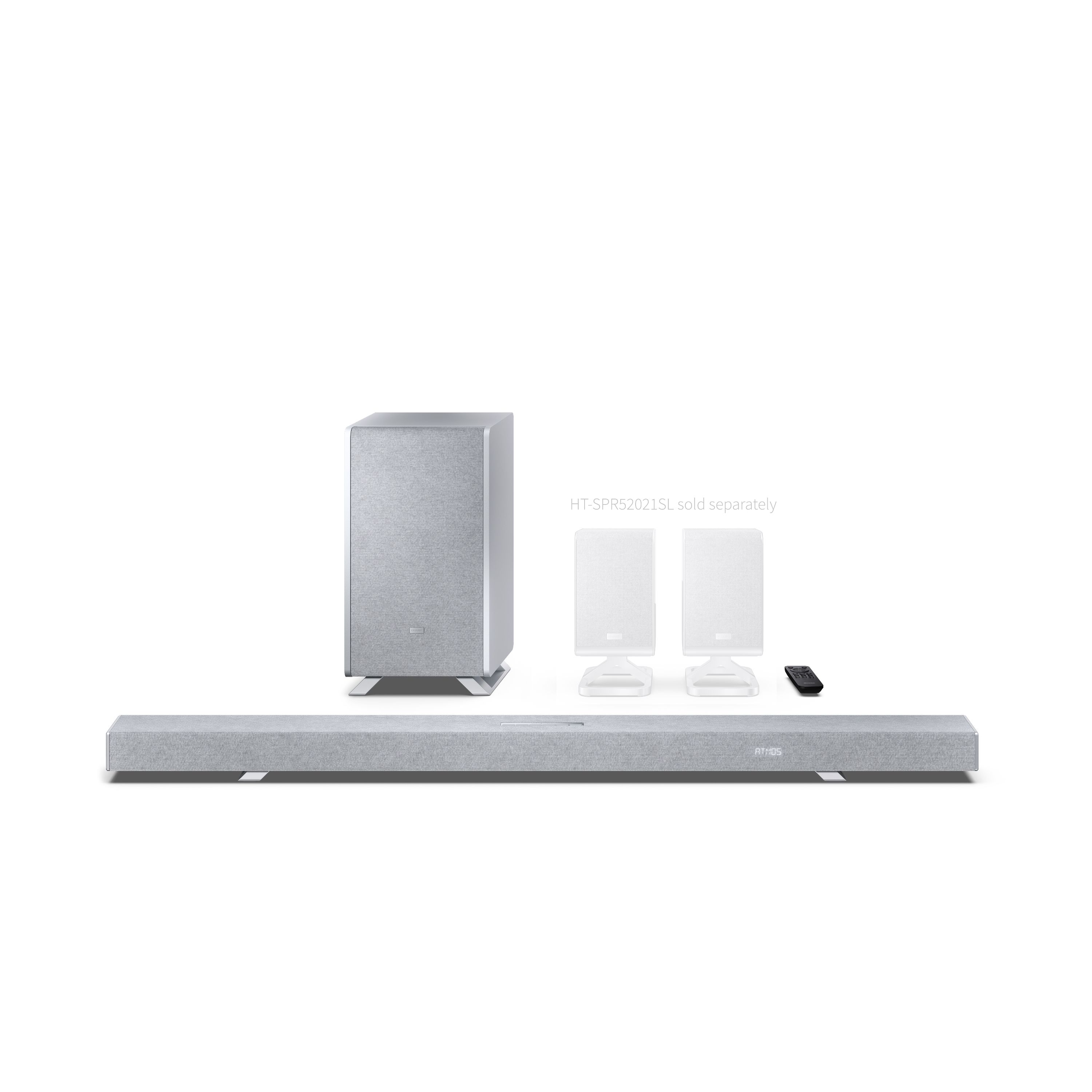 Ein grauer Subwoofer, eine Soundbar und zwei weiße Satellitenlautsprecher mit Fernbedienung.