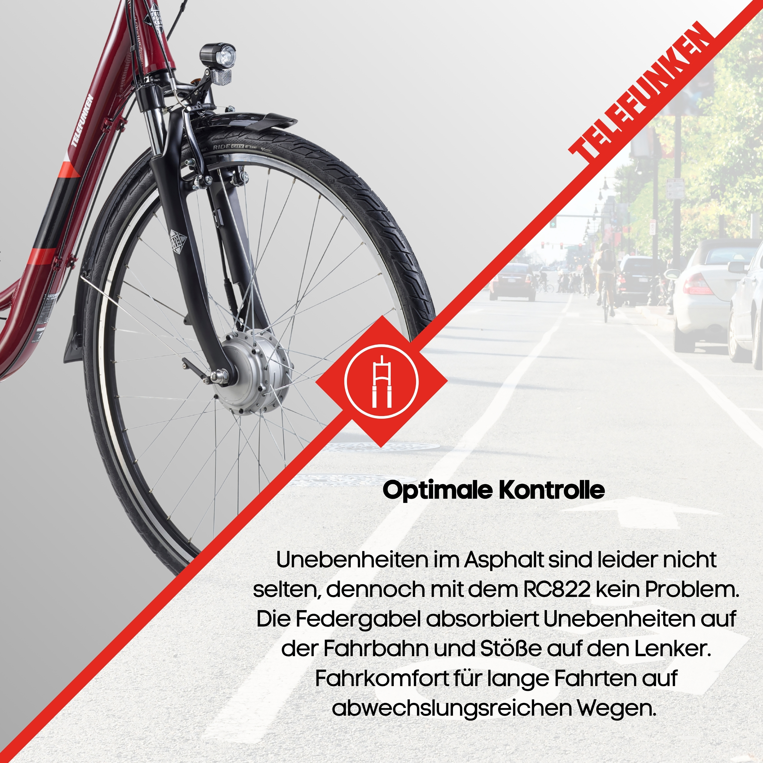 Rotes Fahrrad mit Federgabel und Scheinwerfer, auf asphaltierter Straße.