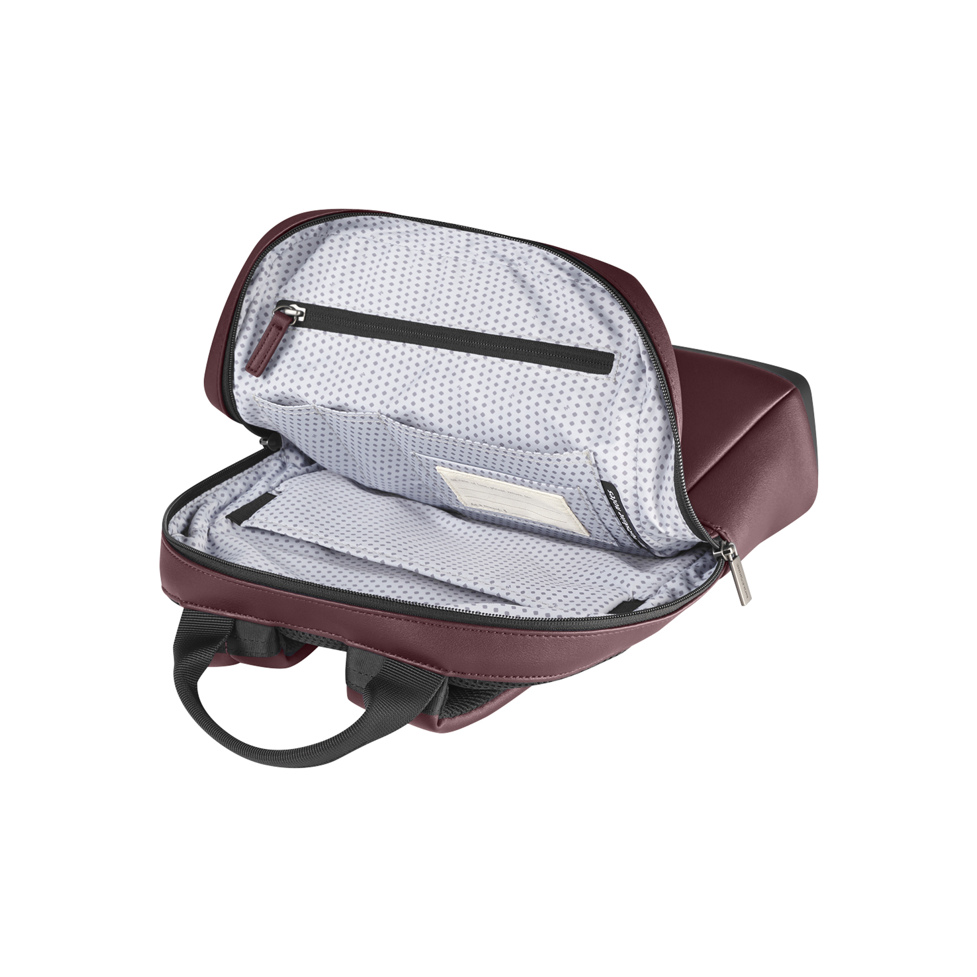 Uno zaino aperto color bordeaux con fodera interna bianca a fantasia.